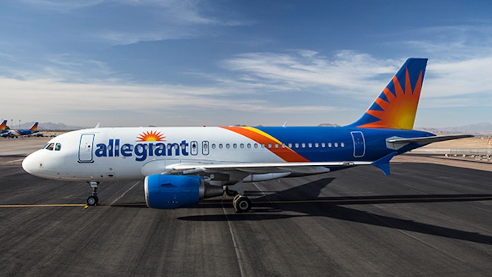 Allegiant Air plane parked on an airport runway during travel disruption coverage