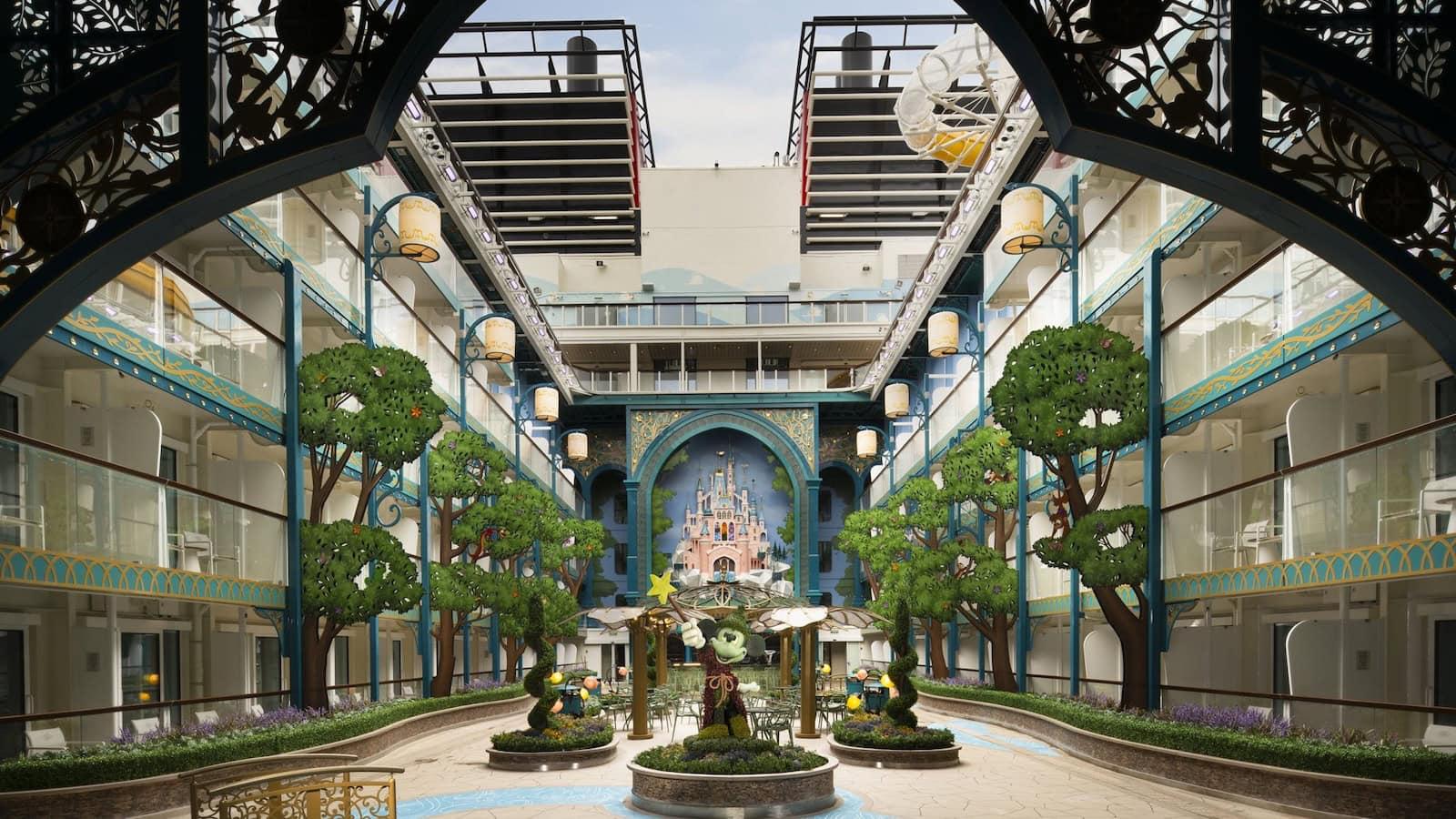 Imagination Garden central hub aboard the Disney Adventure cruise ship with stage and Disney storytelling elements