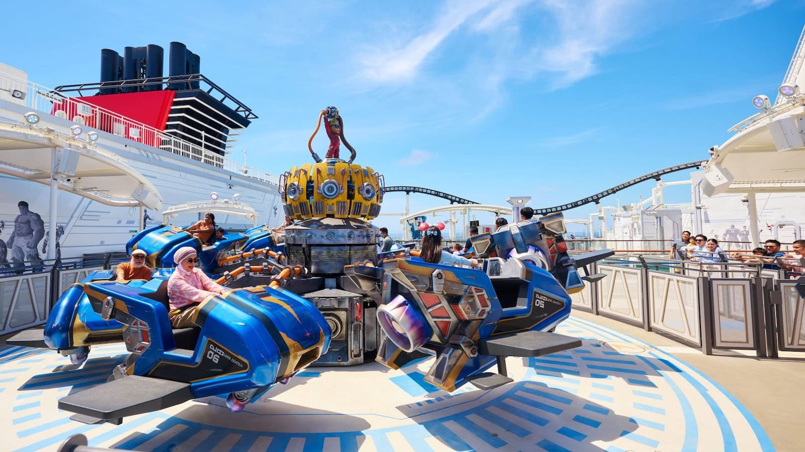 Guests riding a Marvel themed attraction in Marvel Landing on the Disney Adventure cruise ship