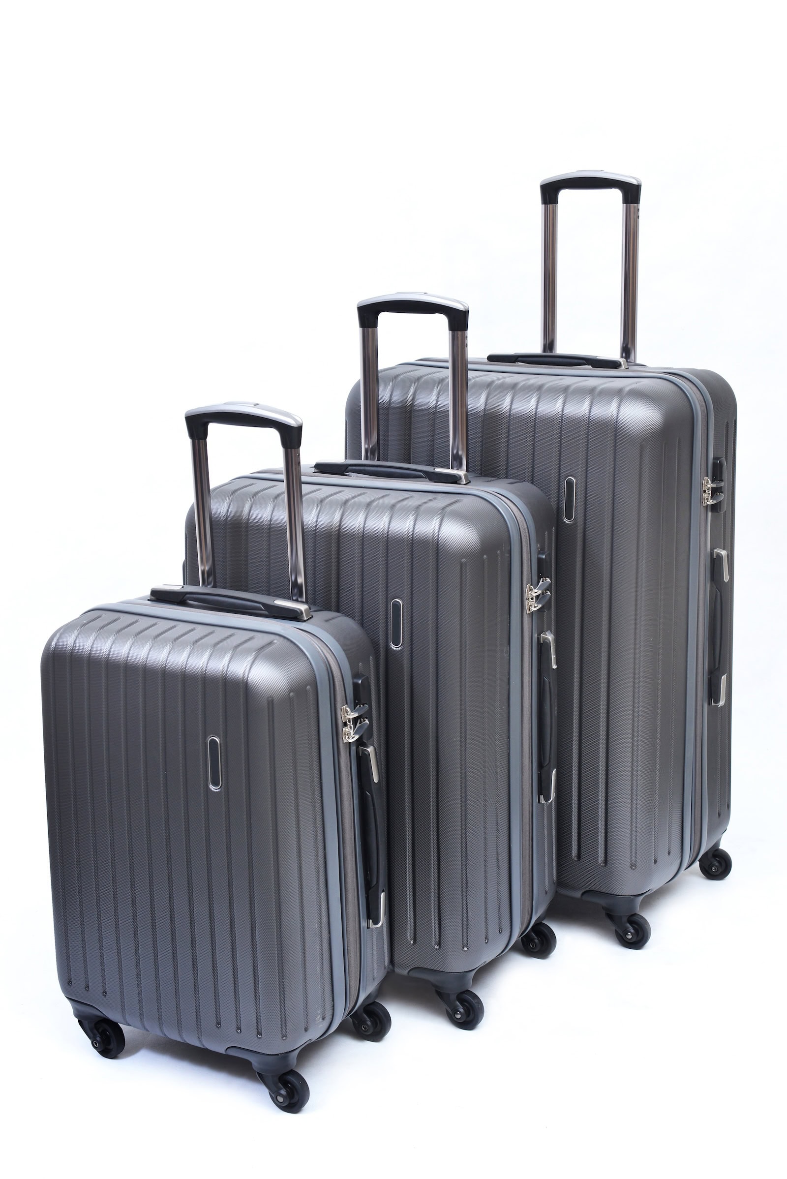 A set of hard shell suitcases packed and ready for check-in