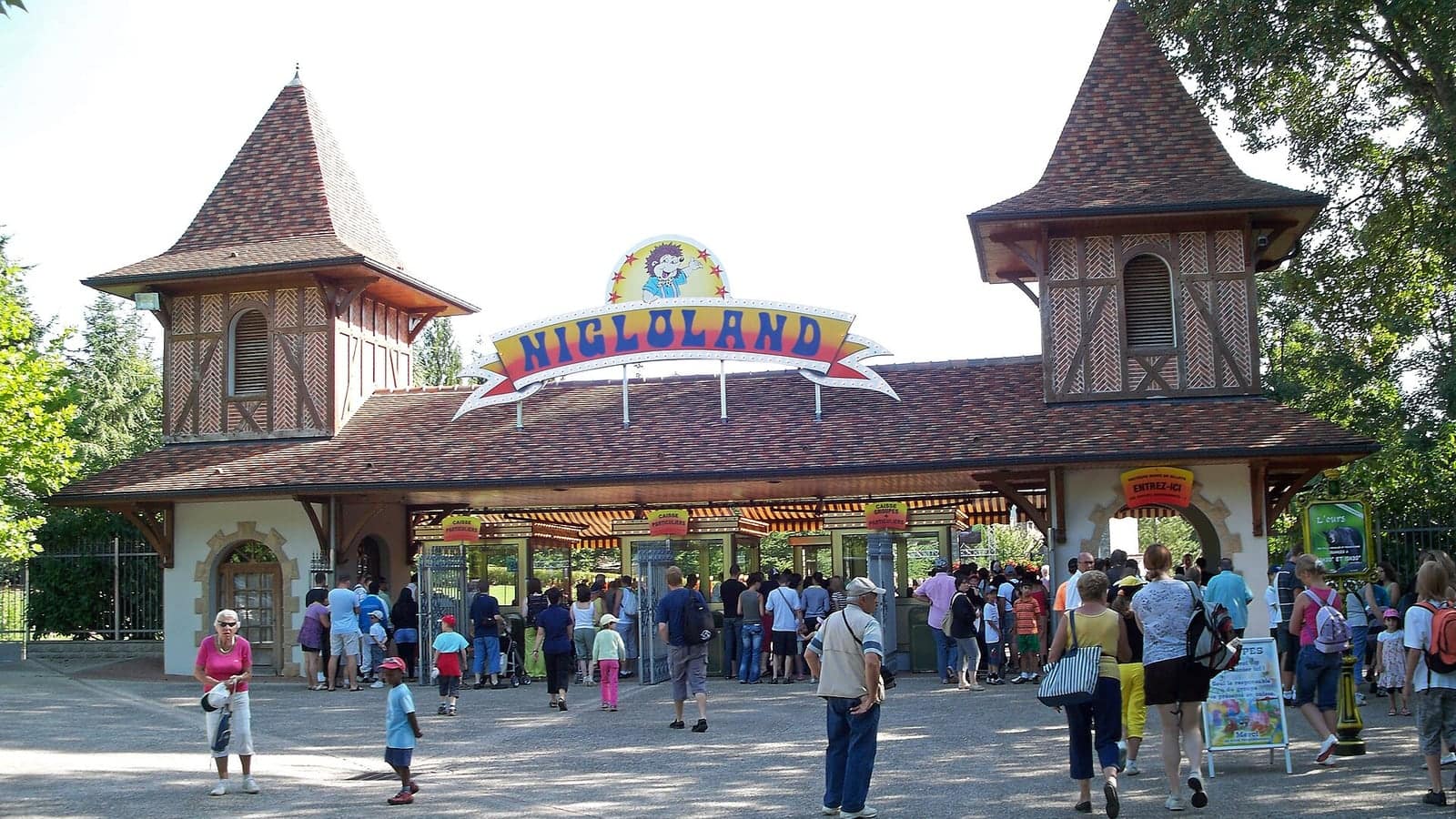 The welcoming and colorful primary entrance gates of Nigloland theme park in France.