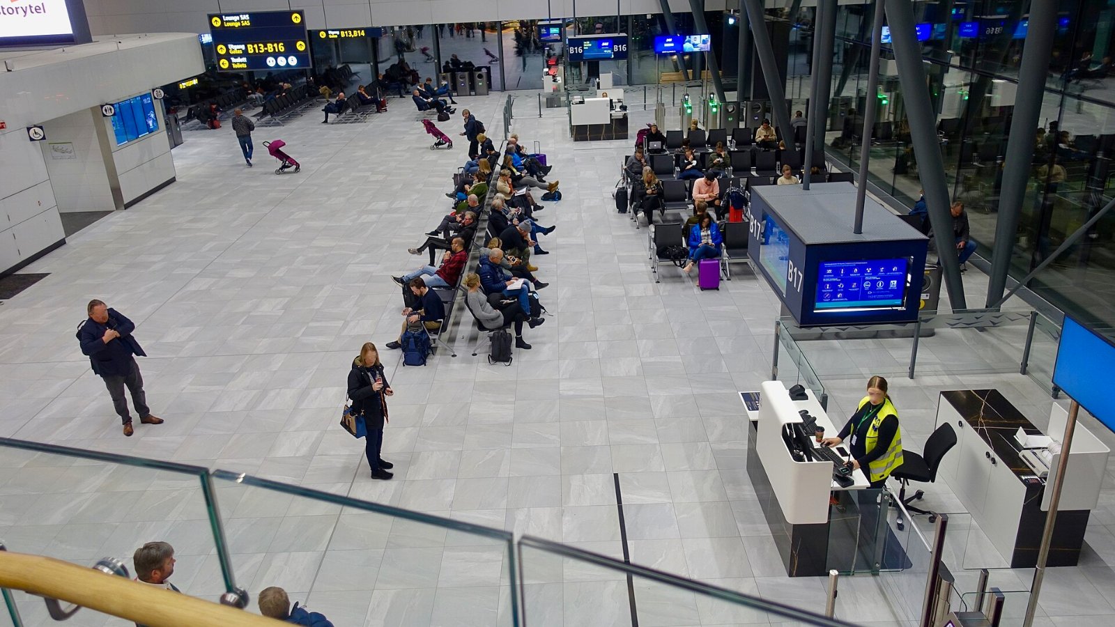 Carry-on bags being checked against airport bag sizers