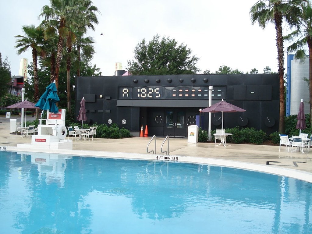 A giant boom box icon towering over a guest building in the Calypso section of Disney's All-Star Music Resort