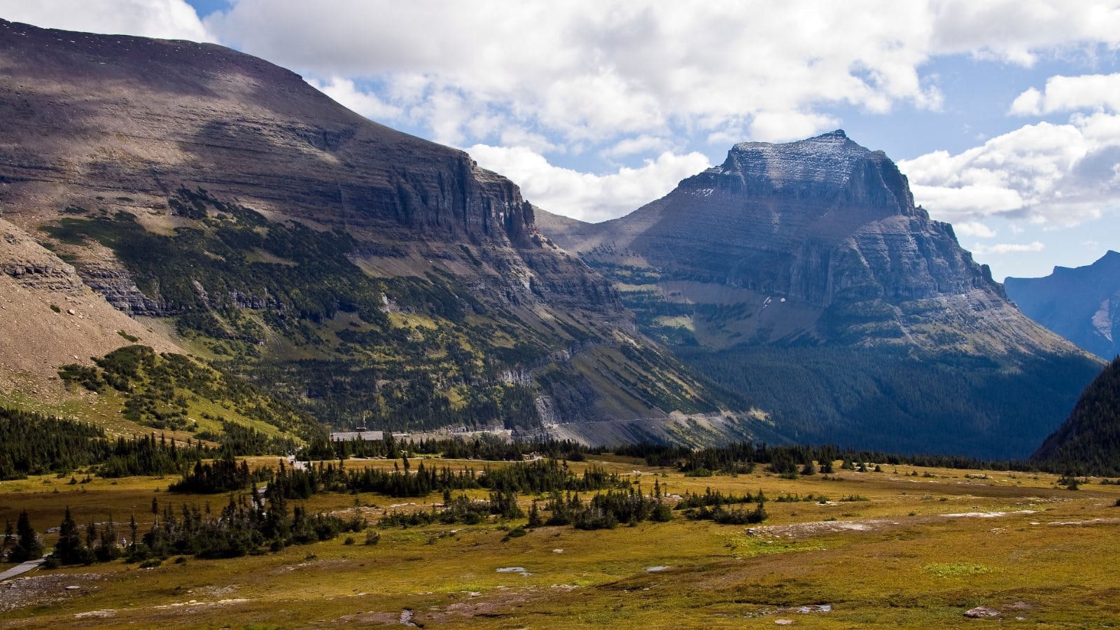 Logan Pass in Glacier National Park with alpine peaks above the Going-to-the-Sun Road corridor
