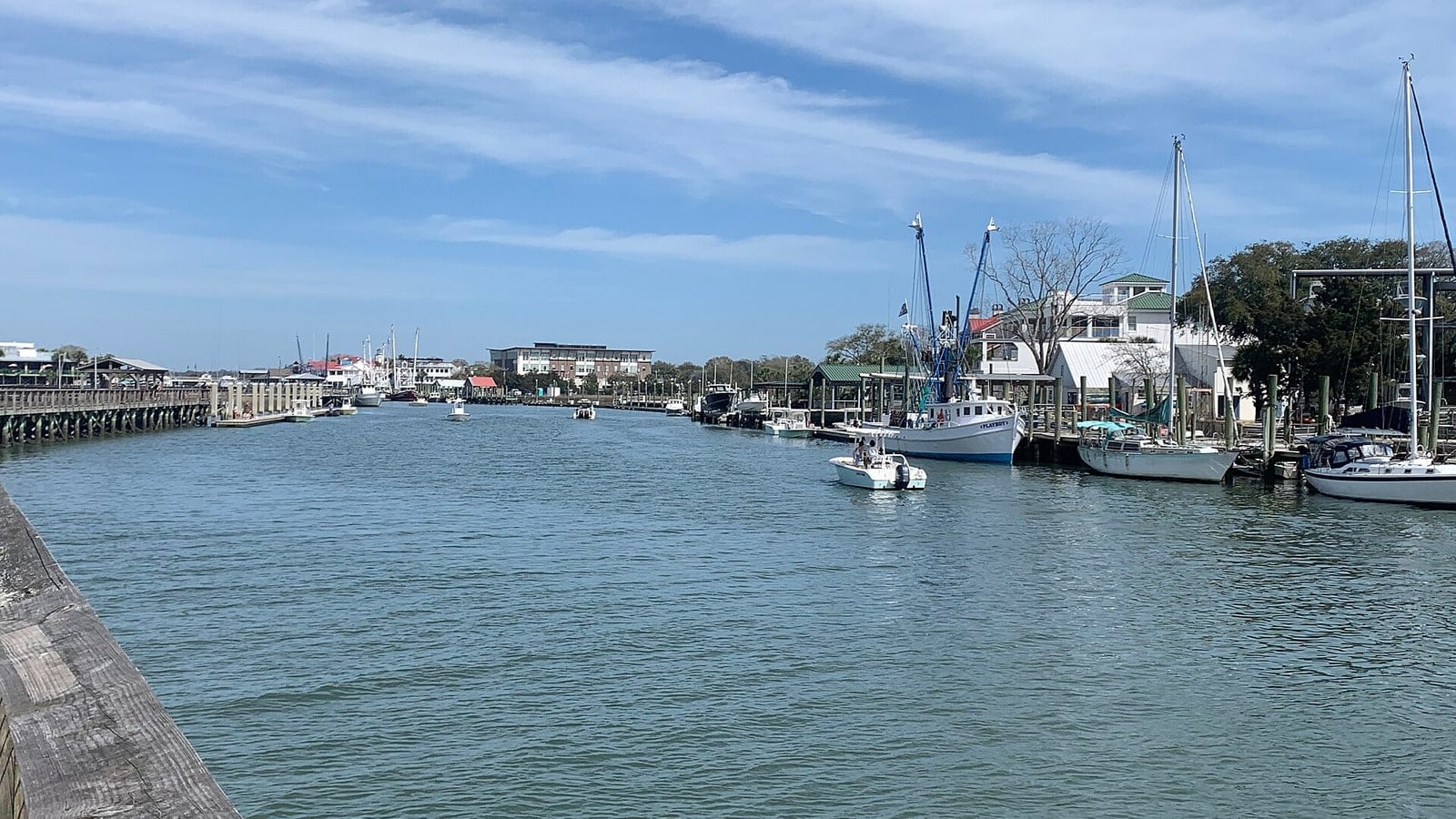Shem Creek in Mount Pleasant with boats, docks, and marsh water
