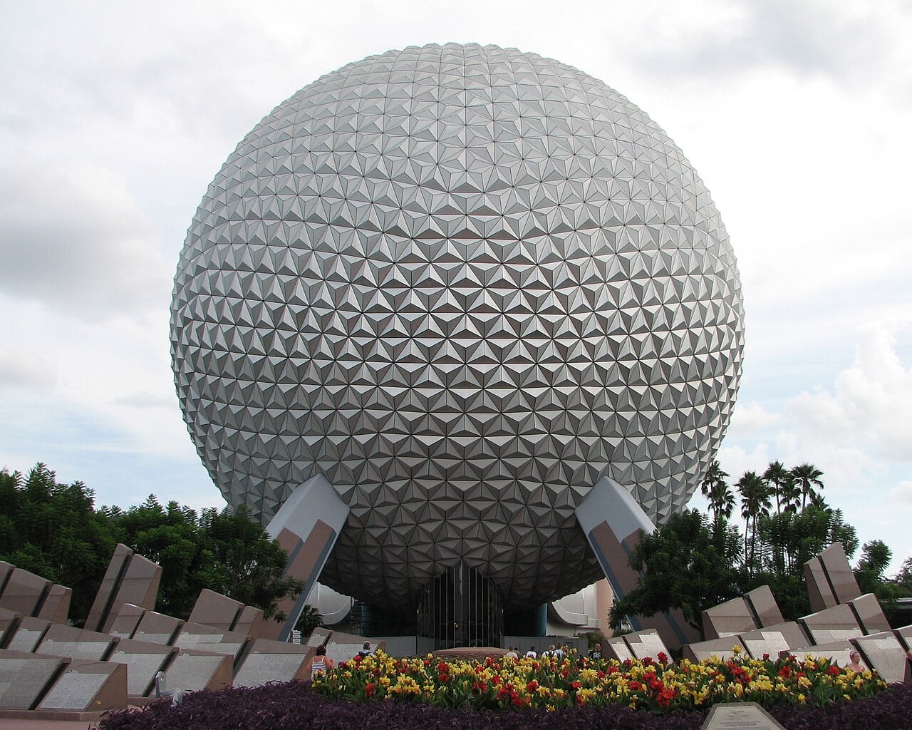 Spaceship Earth geosphere at EPCOT seen from the park entrance in daylight