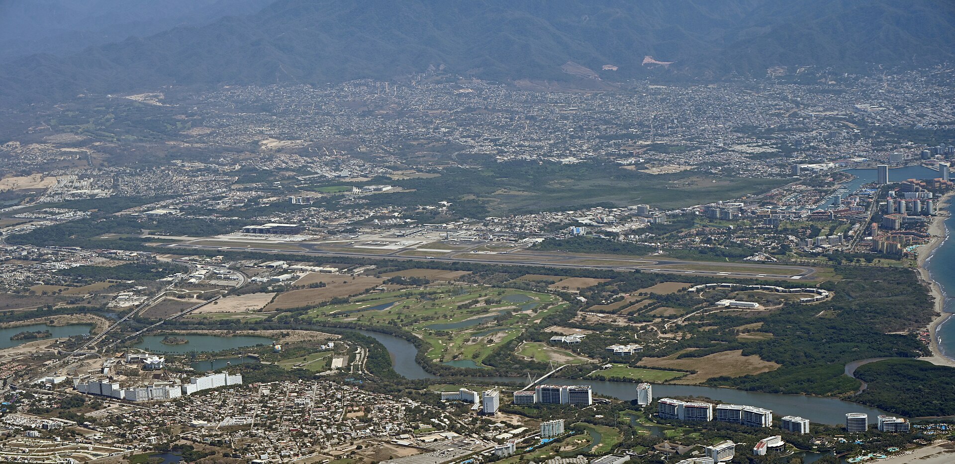 An aerial view of the main passenger terminal building at Gustavo Diaz Ordaz International Airport in Puerto Vallarta.