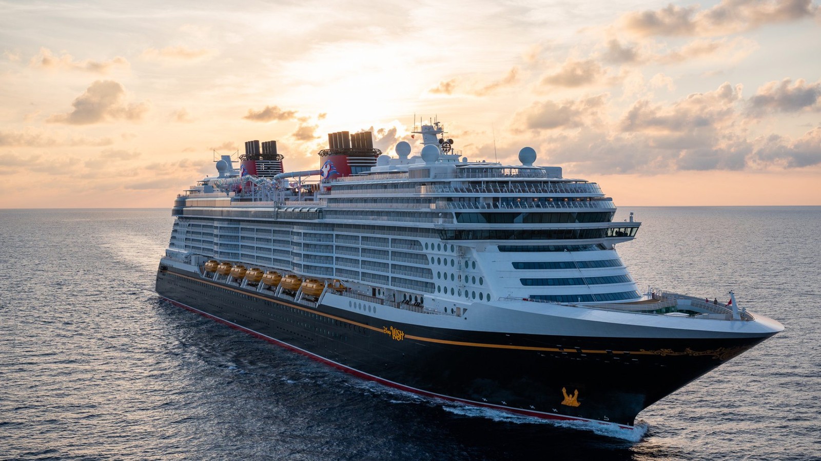 Disney Wish cruise ship at sunset