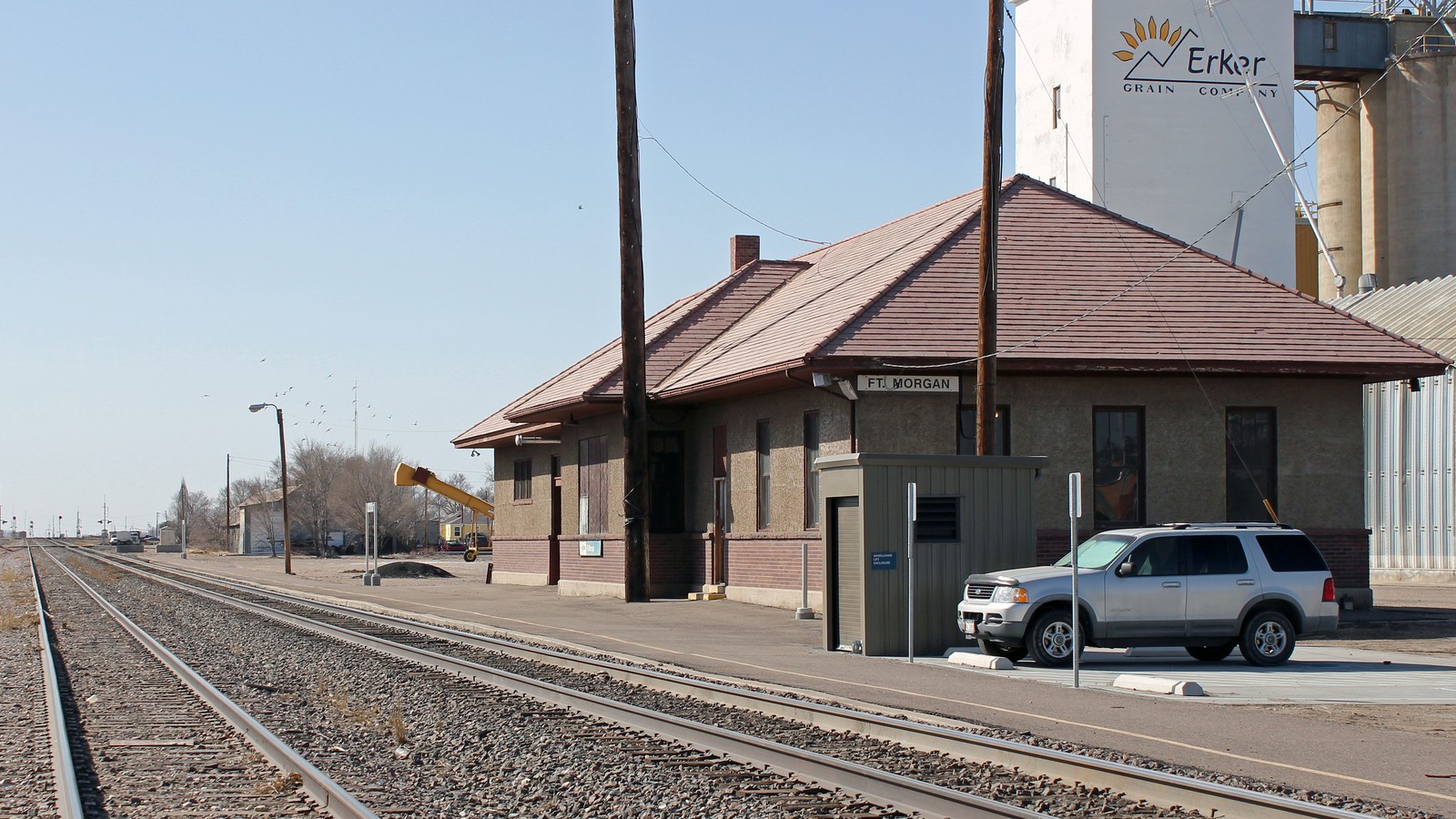 Amtrak station building and platform area in Fort Morgan Colorado under clear sky