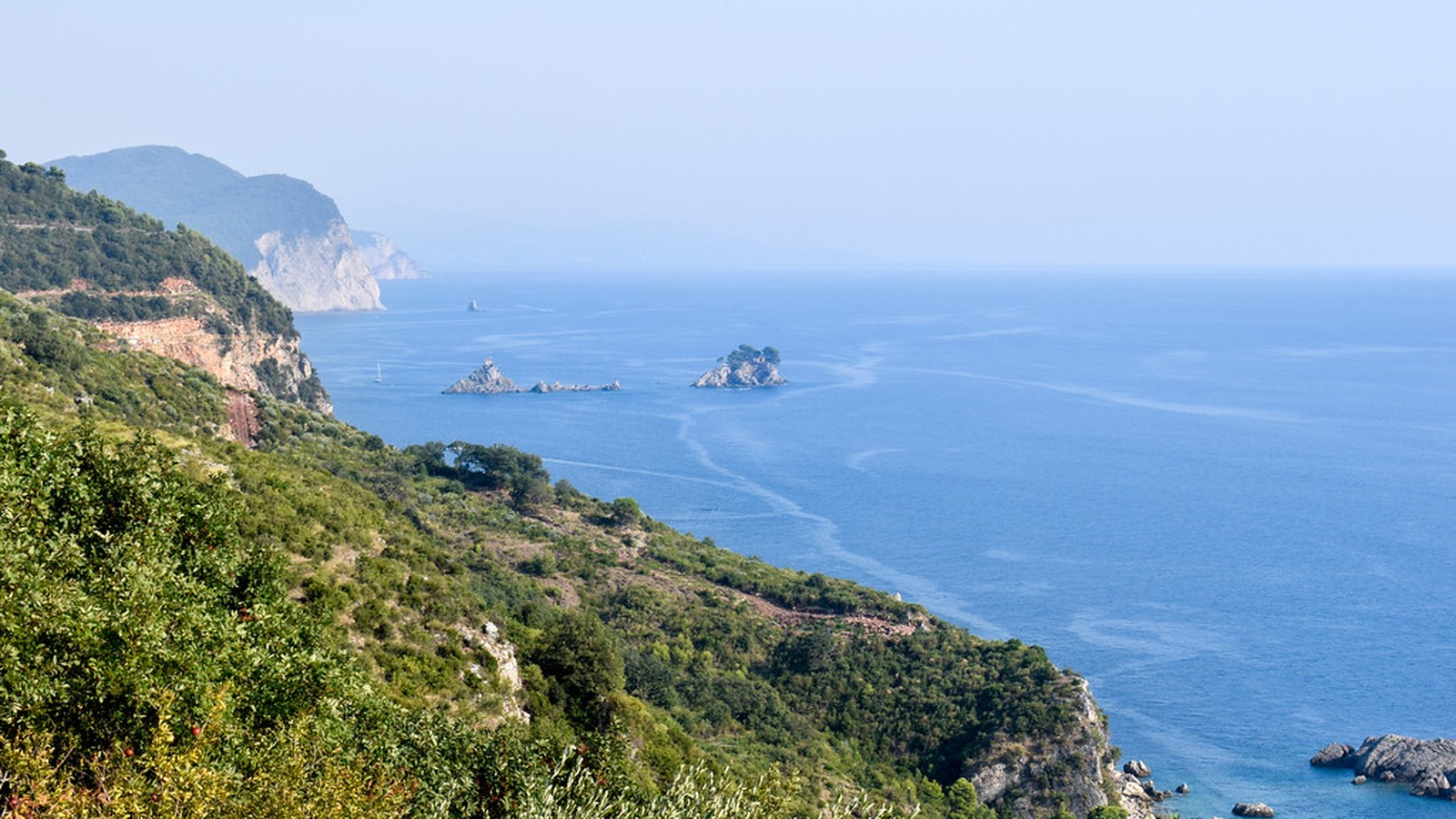 Montenegro Adriatic coastline with cliffs and blue sea under clear sky