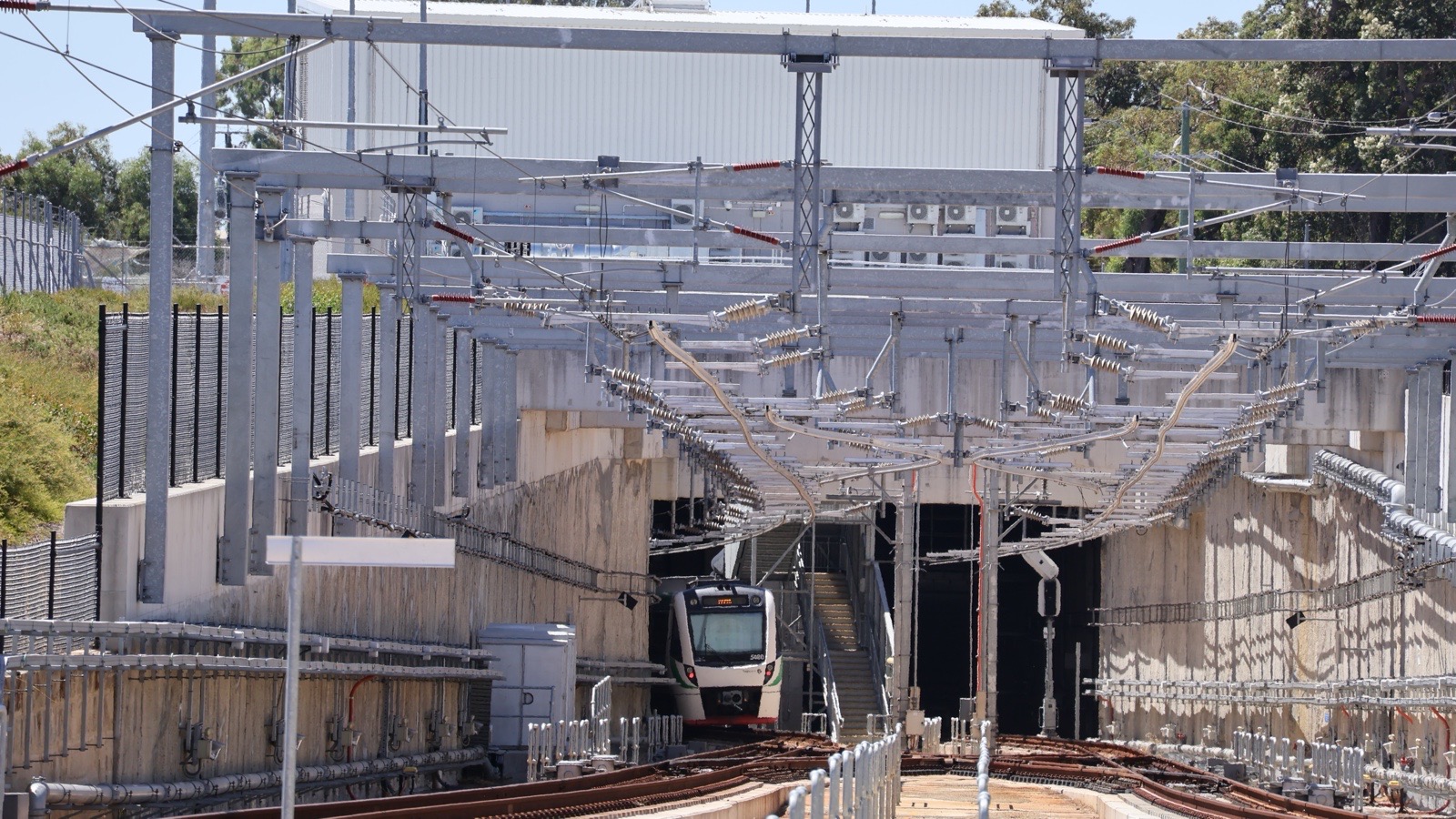 Transperth B series train entering the Airport Line tunnel at High Wycombe station in Perth