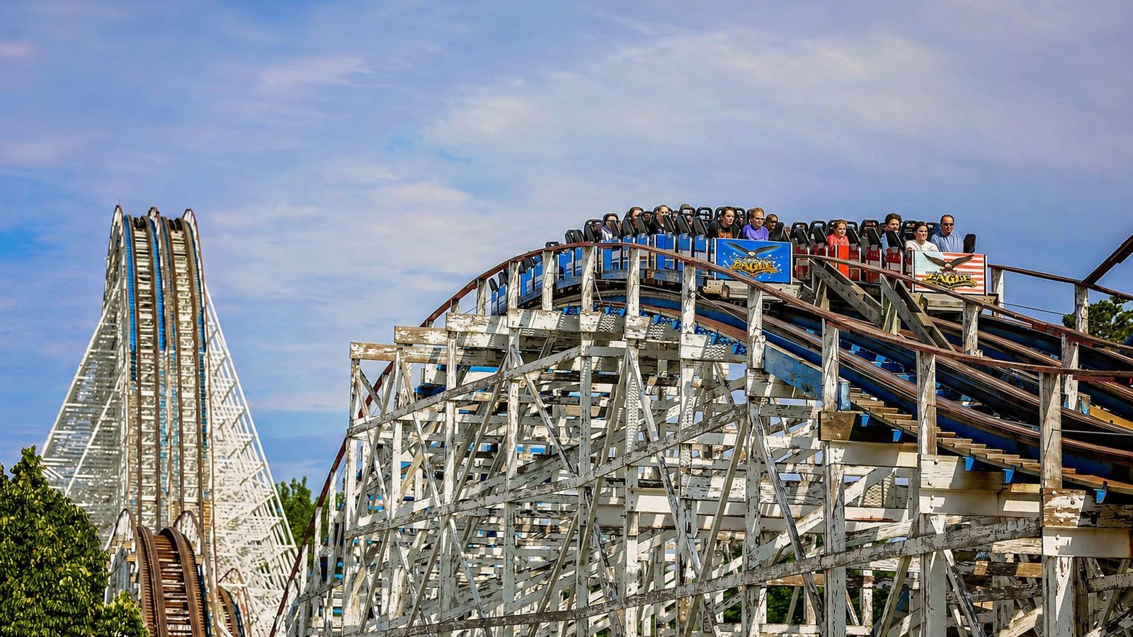 American Eagle racing wooden coaster trains on twin white structure at Six Flags Great America