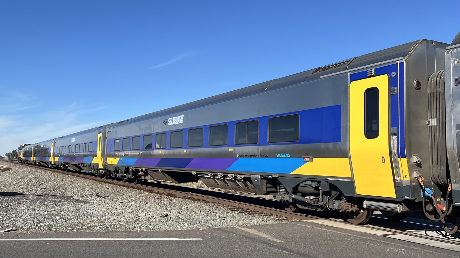 Amtrak San Joaquins Gold Runner corridor Siemens Venture trainset on California tracks under clear sky