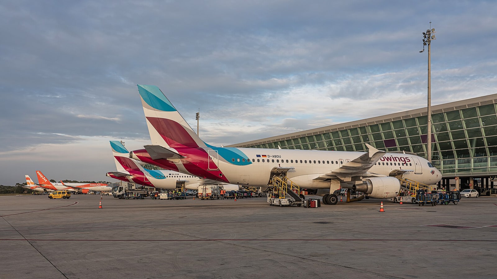 Exterior apron and terminal at Palma de Mallorca Airport under clear sky