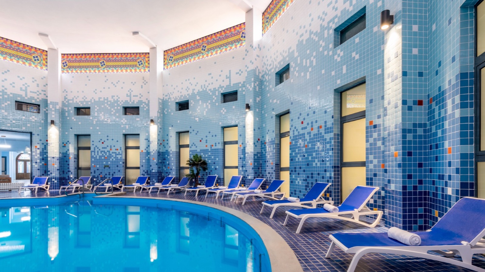 Indoor thermal pool with blue tiled walls at Ensana Sairme South in Georgia