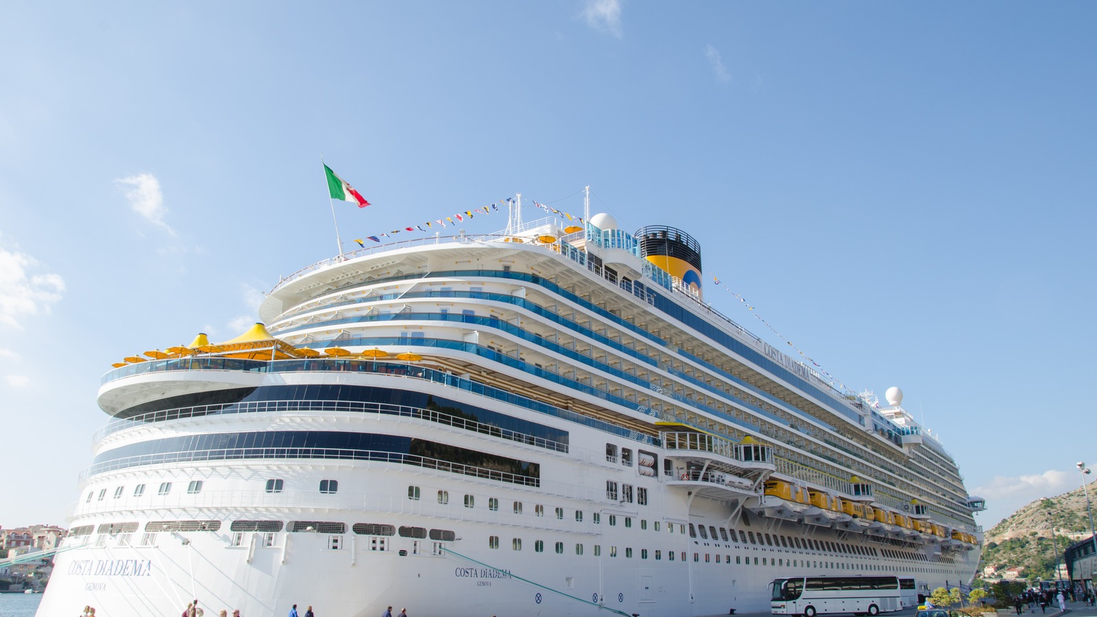 Costa Diadema cruise ship docked at Dubrovnik with coastal hills behind the port