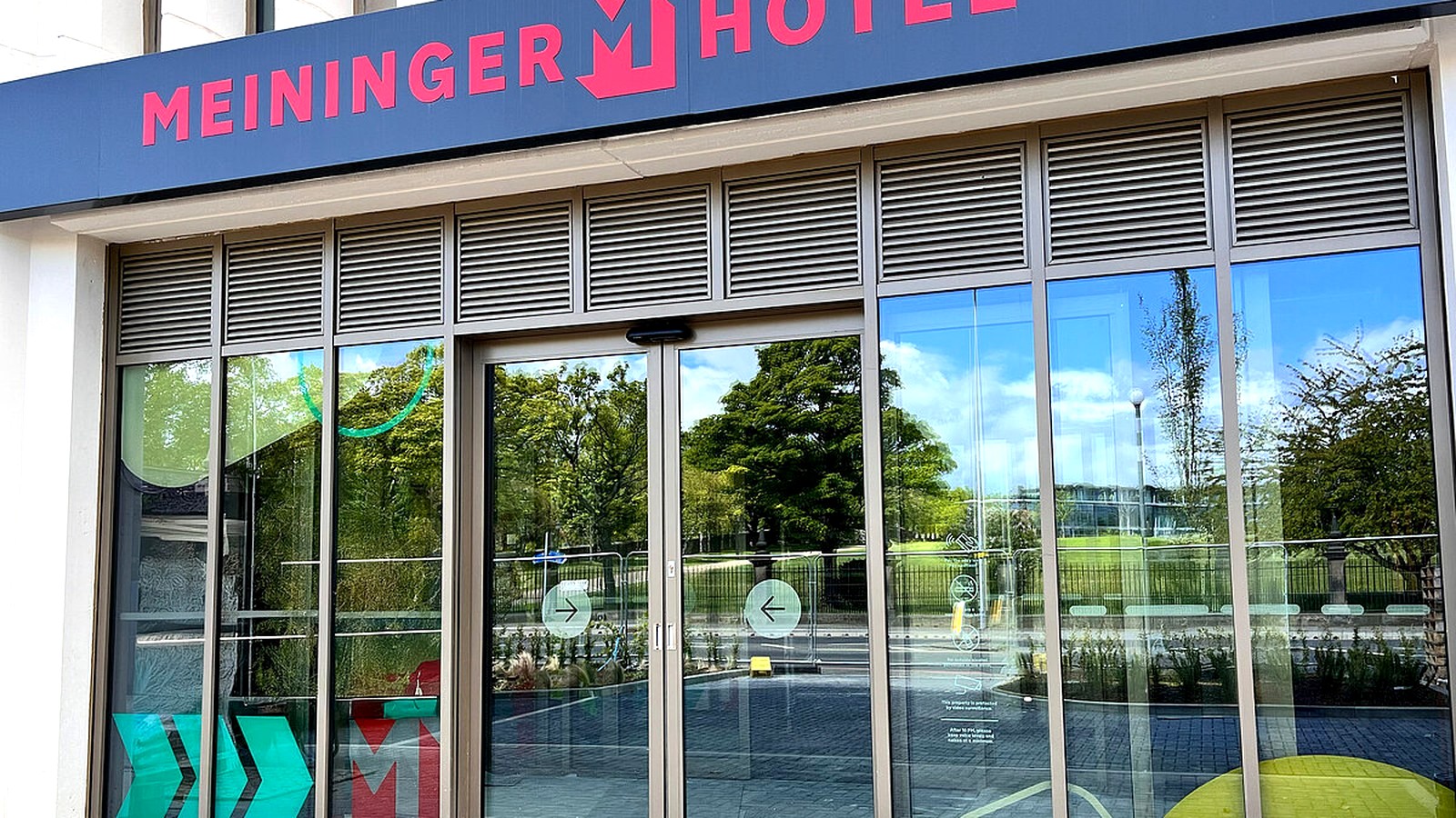 MEININGER Hotel Edinburgh Haymarket exterior entrance with branded canopy and glass facade