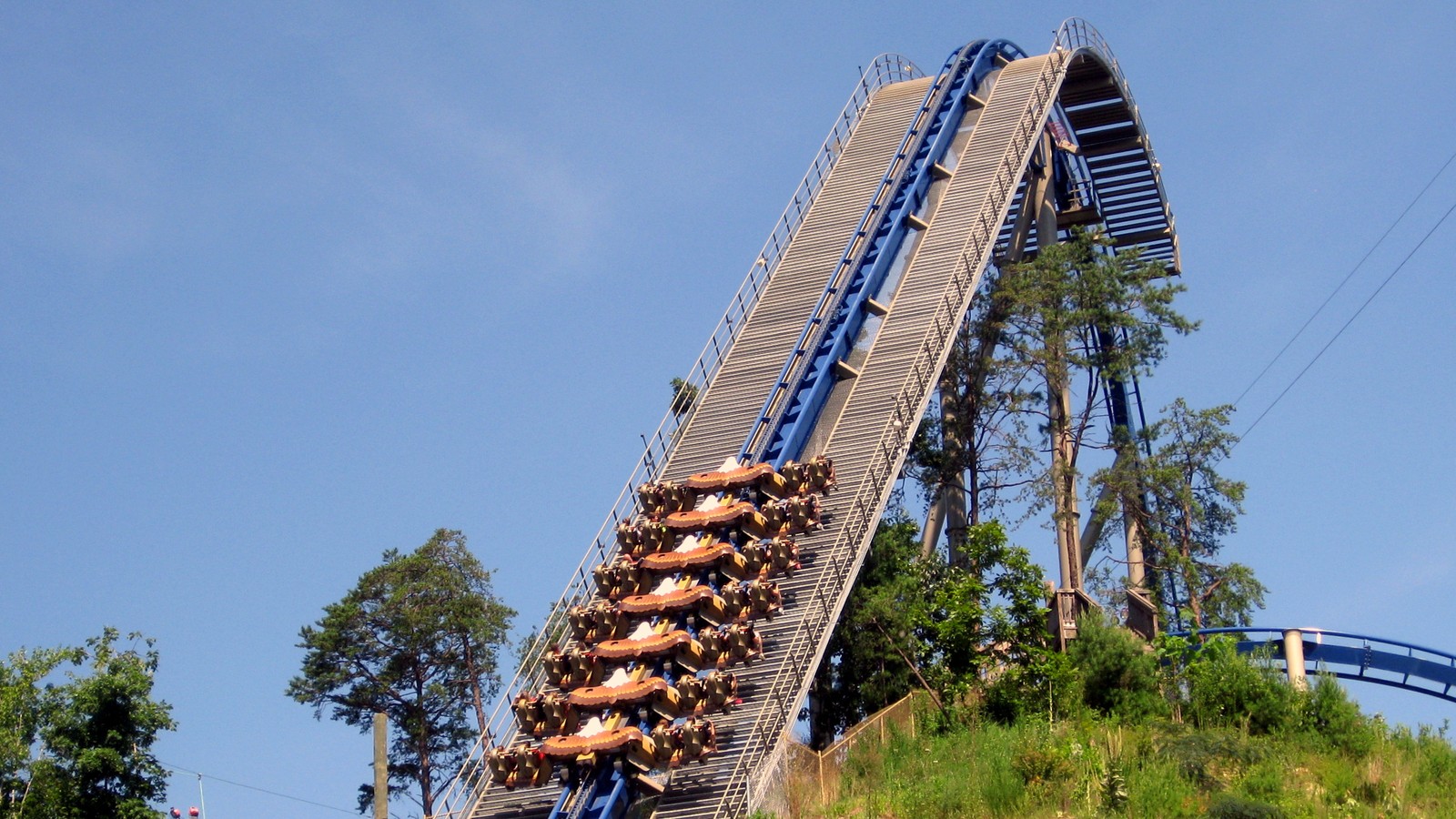 Wild Eagle roller coaster at Dollywood under a bright sky for the park-wide Christmas in July season pass sale