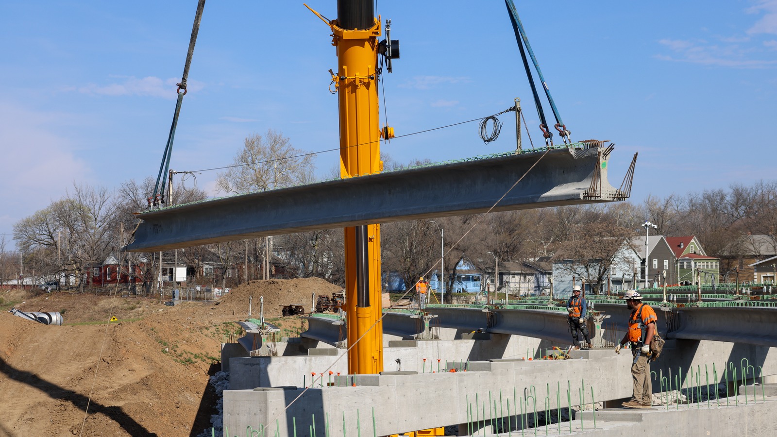 MoDOT crews set a bridge girder on the Improve I-70 Kansas City project