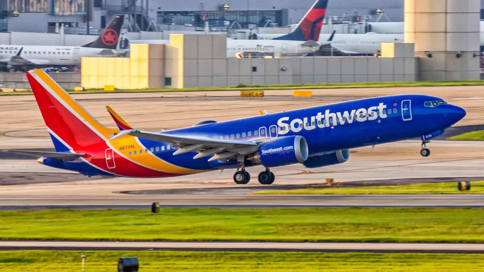 Southwest Airlines Boeing 737 MAX 8 narrowbody jet flying in a clear blue sky