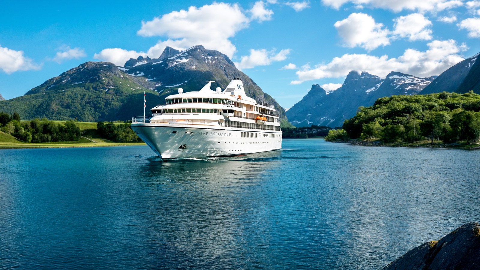 Official rendering of Windstar Cruises Star Explorer sailing through a mountain lined fjord