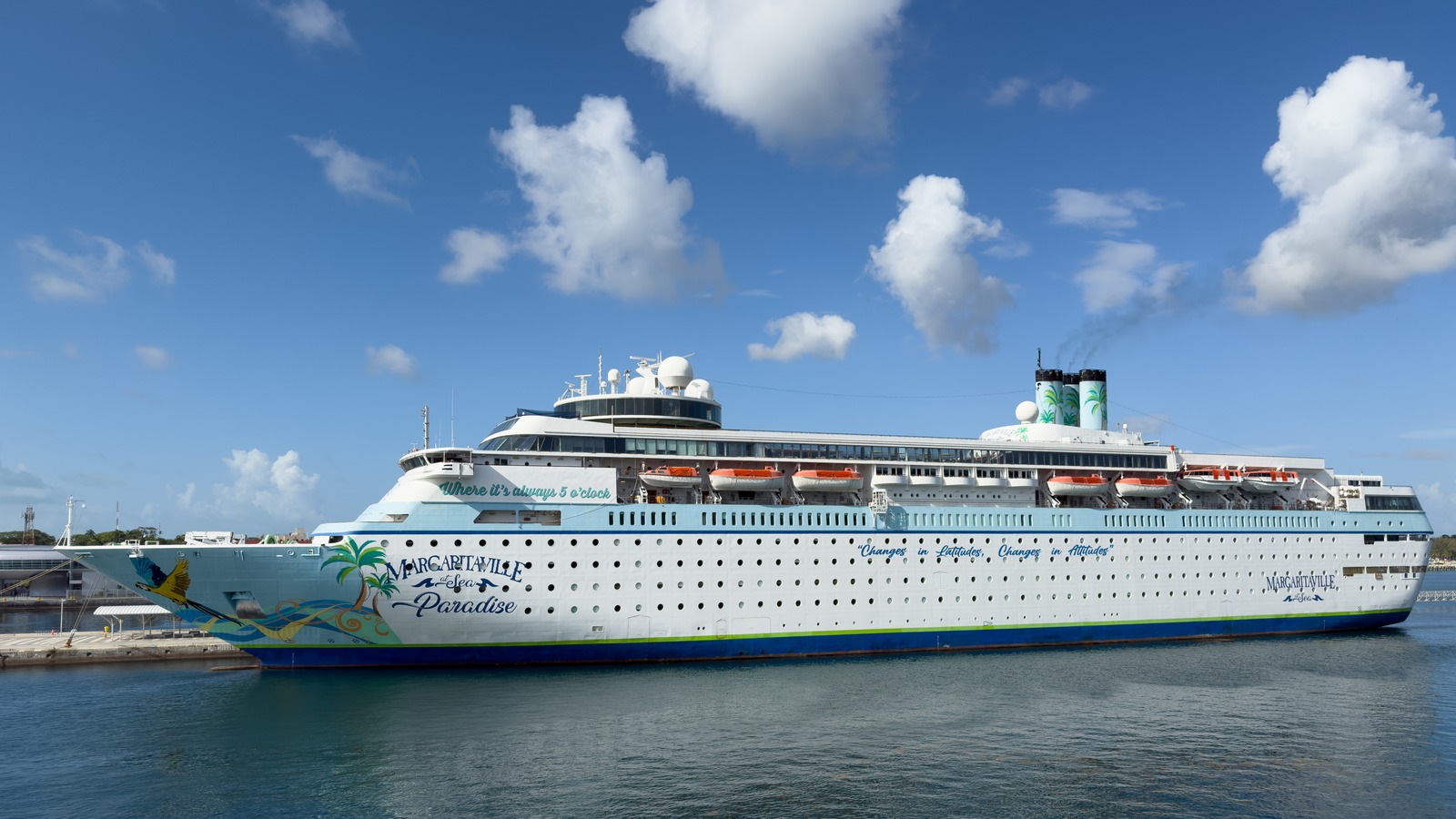 Margaritaville at Sea Paradise cruise ship docked in Nassau under blue sky