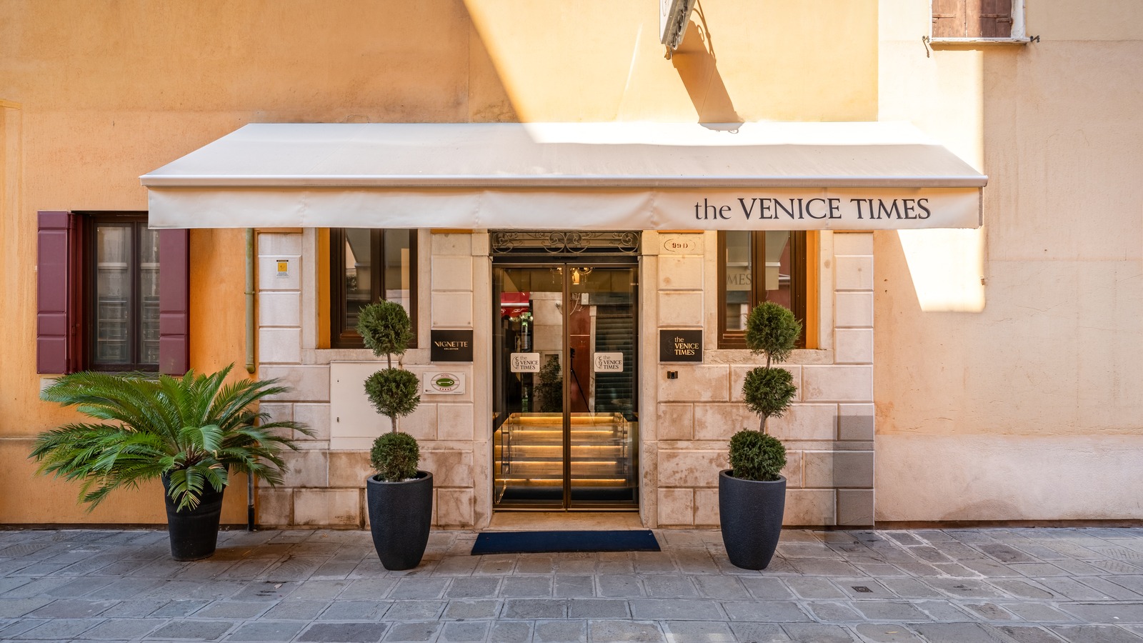 Entrance of The Venice Times Hotel Vignette Collection with awning and Vignette signage in Venice Cannaregio