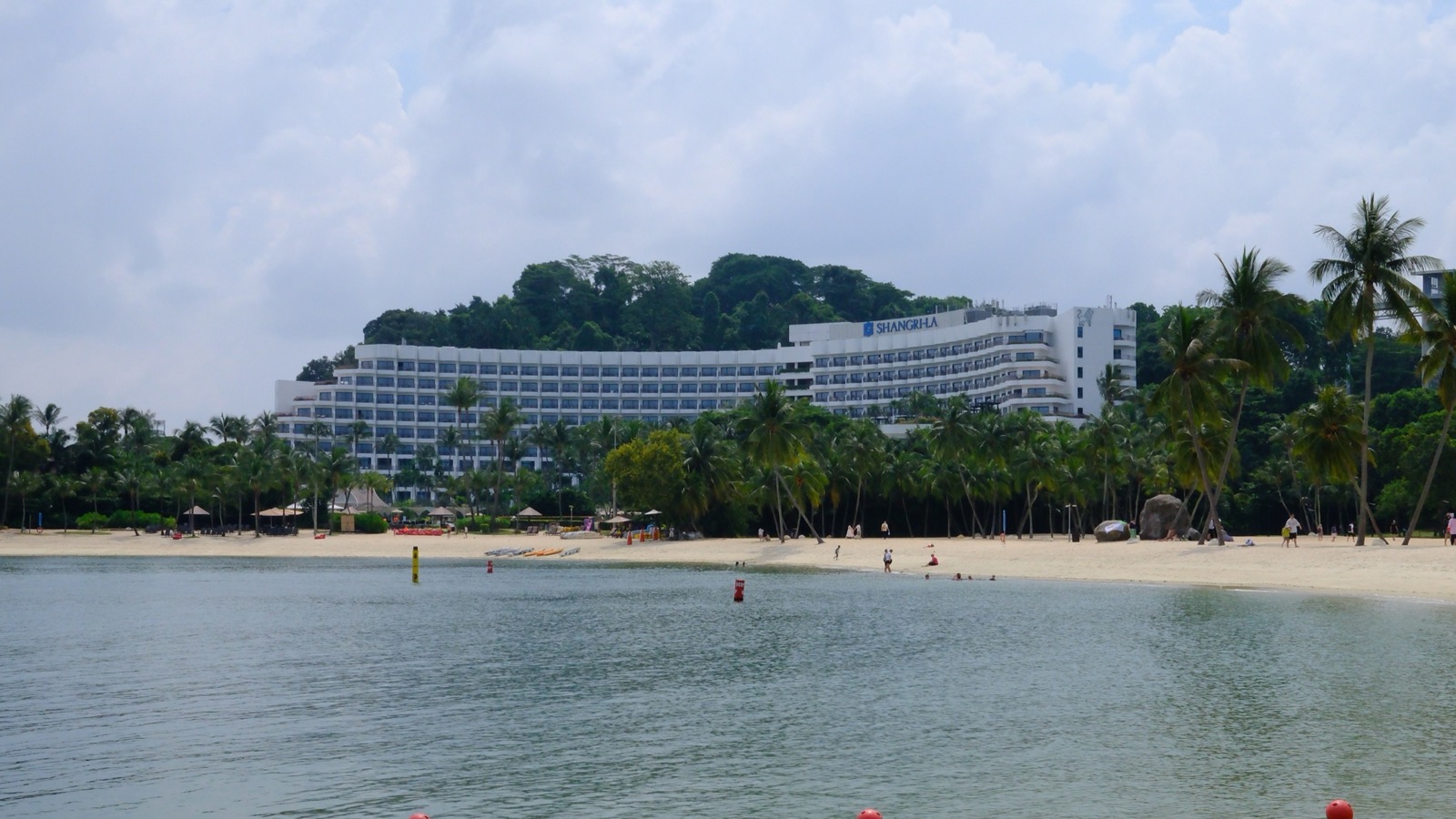 Shangri La Rasa Sentosa hotel viewed across the beach and water in Singapore