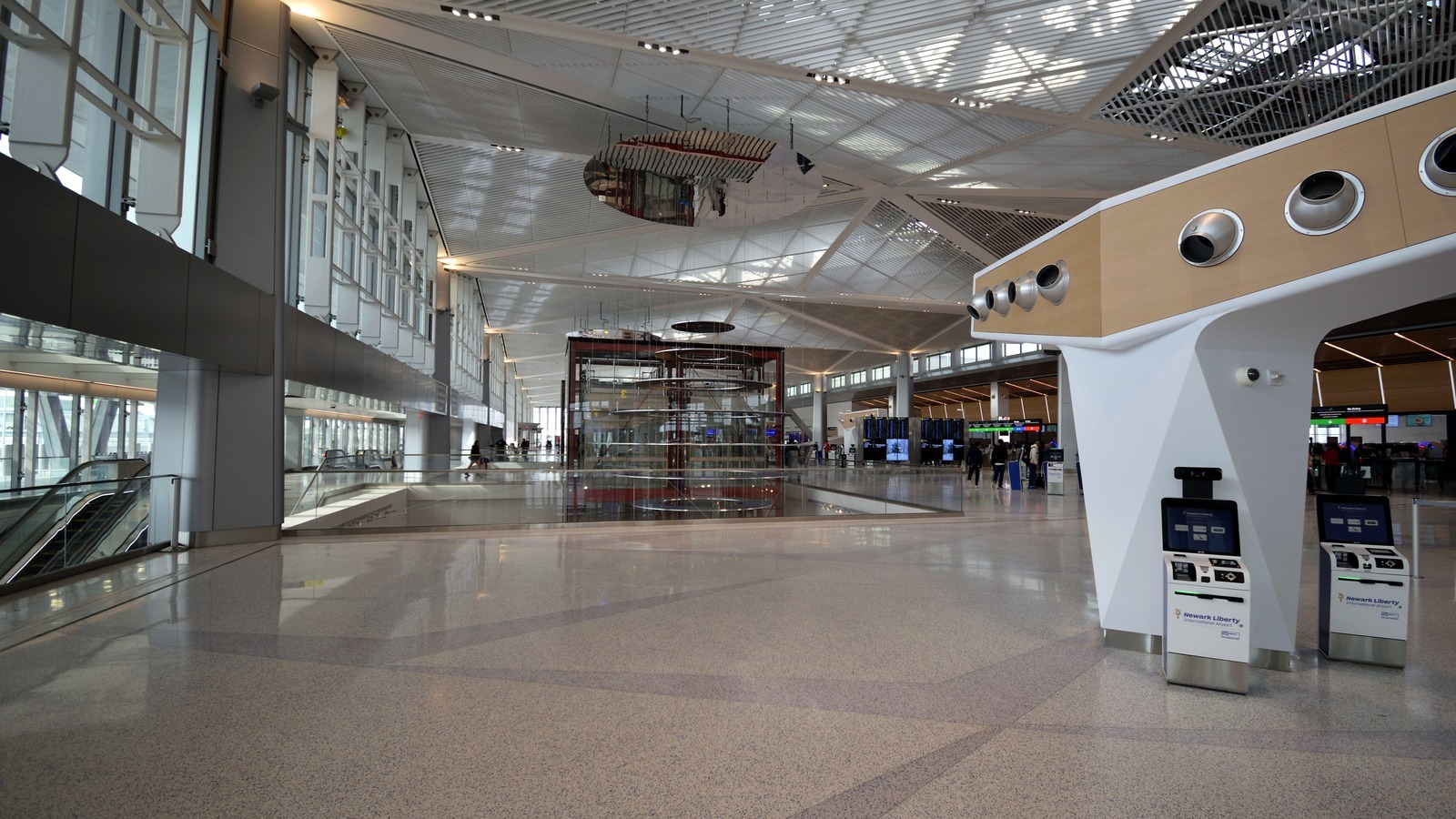 Interior of Terminal A at Newark Liberty International Airport with Newark Liberty branded kiosks