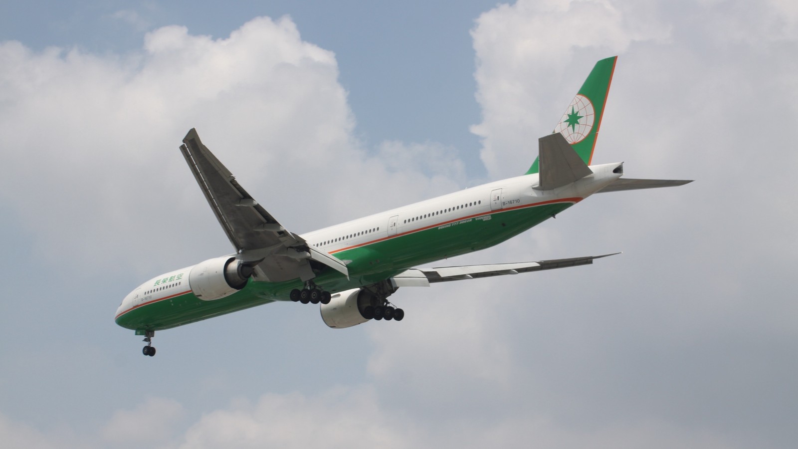 EVA Air Boeing 777 airborne under clear sky