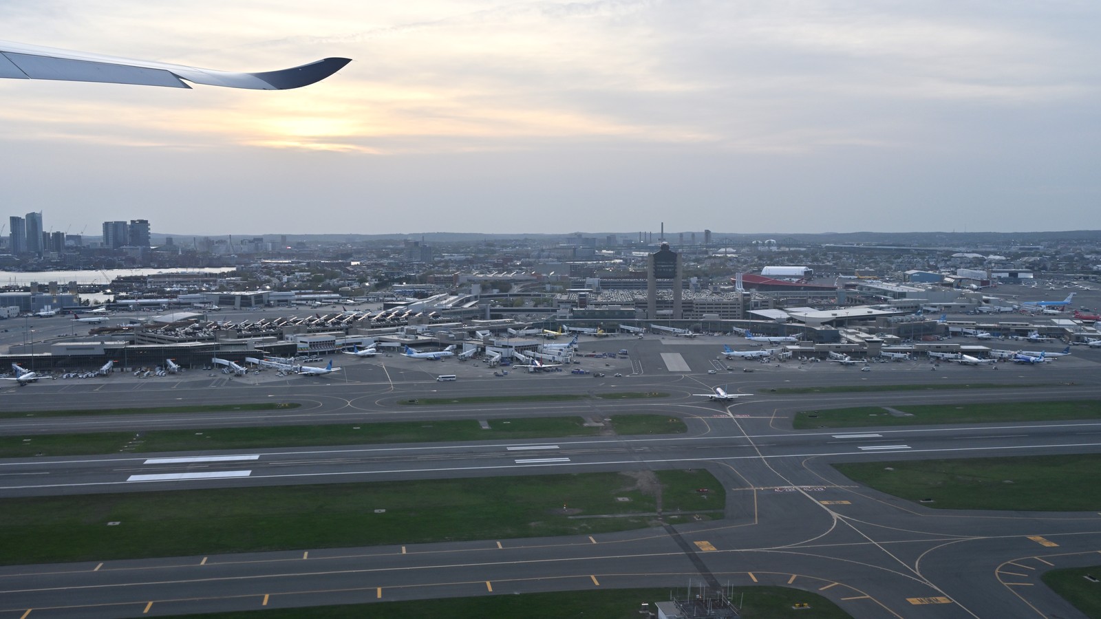 Aerial view of Boston Logan International Airport and runways from a departing aircraft
