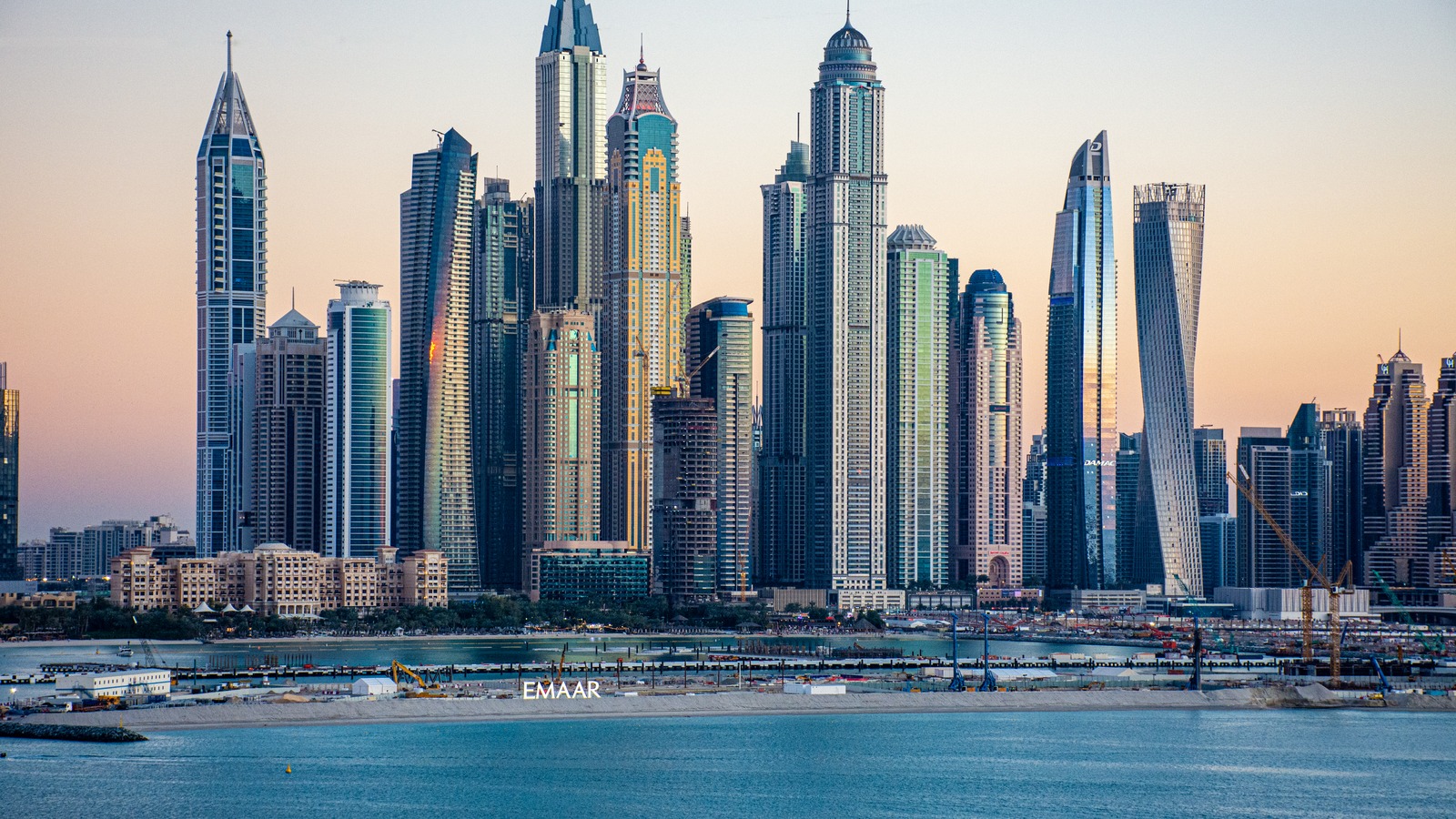 Dubai Marina skyline across the water at dusk