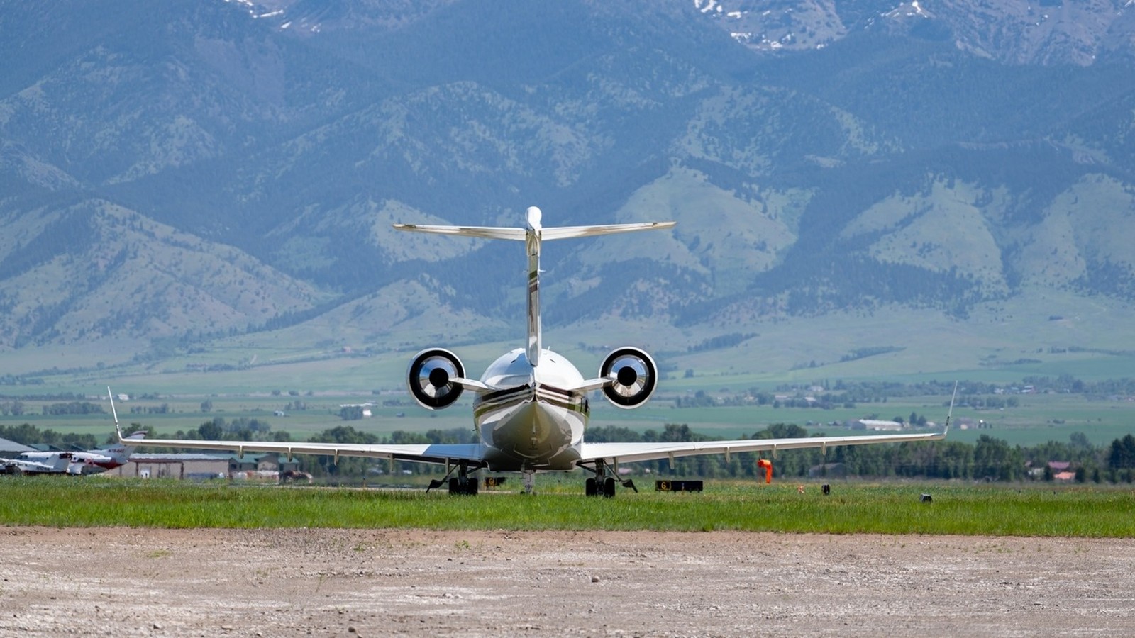 Aircraft on the ramp at Bozeman Yellowstone International Airport with Bridger Range beyond