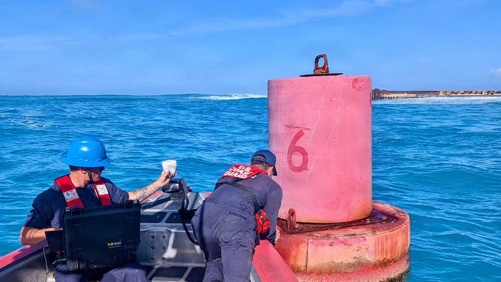 U.S. Coast Guard crew checks an aid to navigation in Tinian waters on July 10, 2026