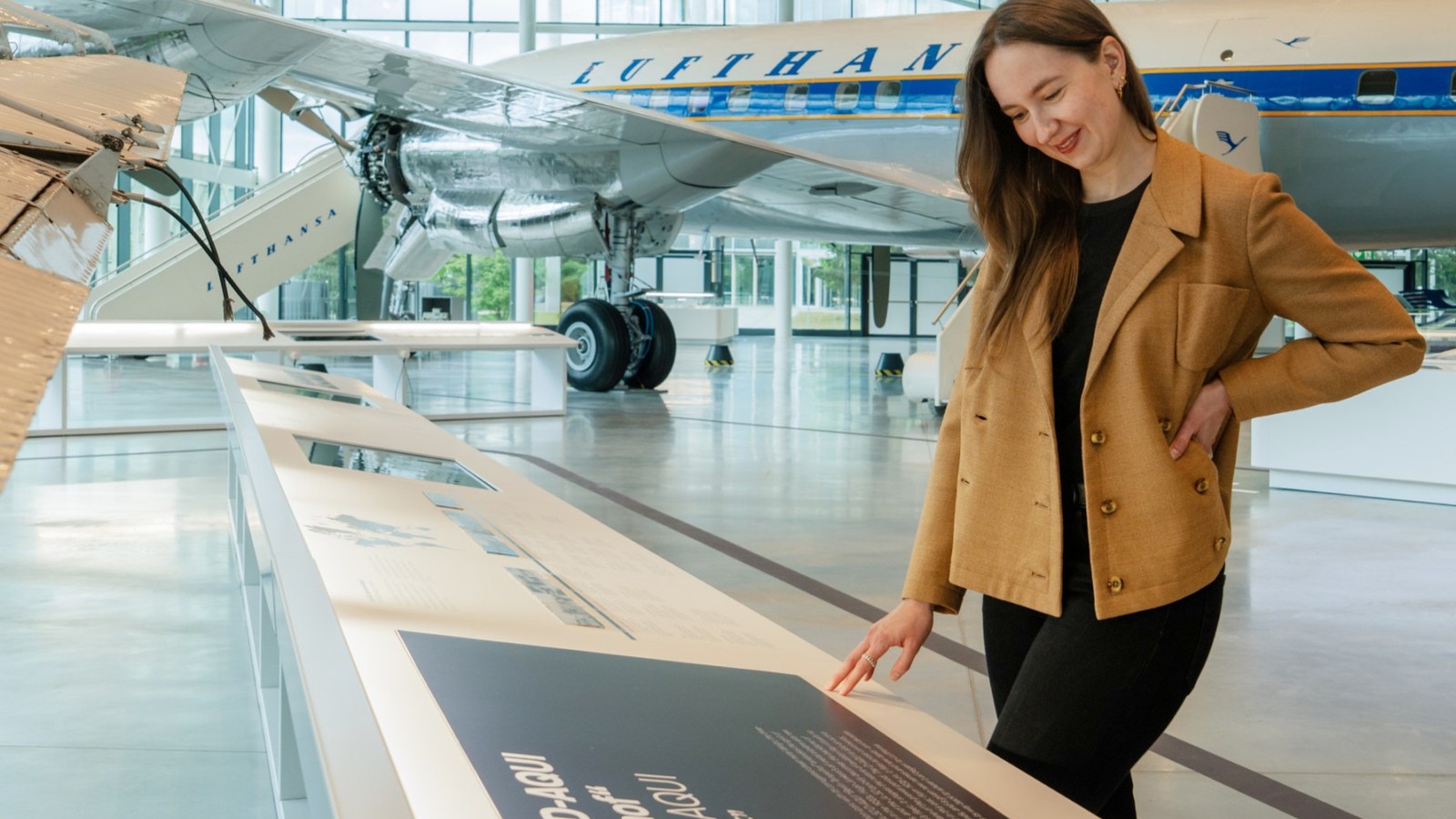 Interior of Lufthansa Group Hangar One visitor center at Frankfurt Airport with historic aircraft displays