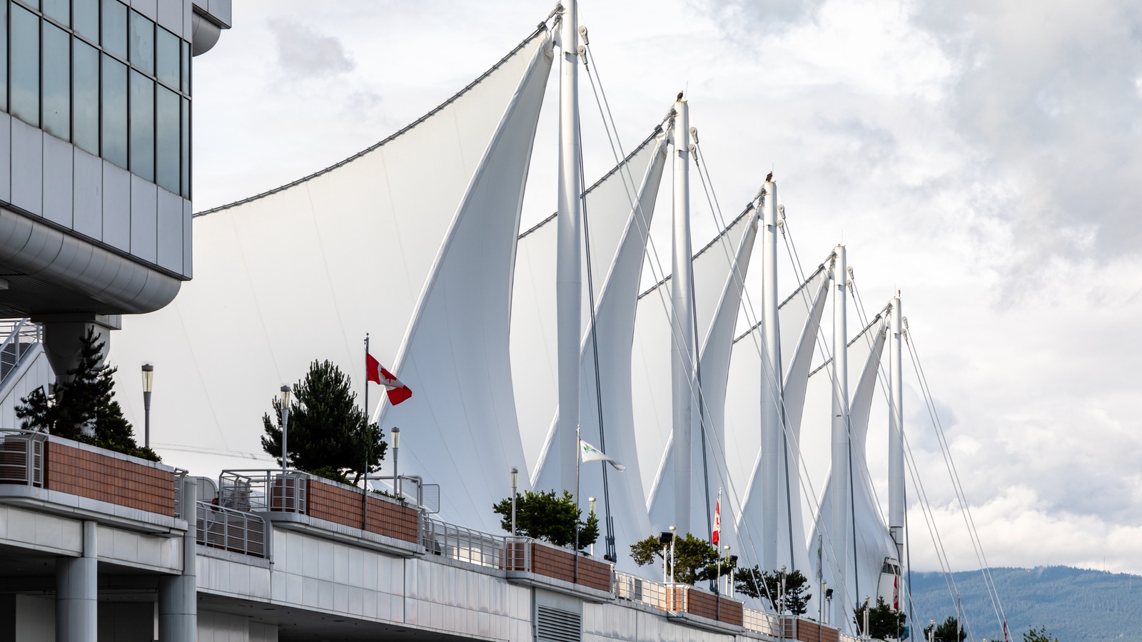 Canada Place sail roofs and waterfront walkway at the Vancouver cruise terminal