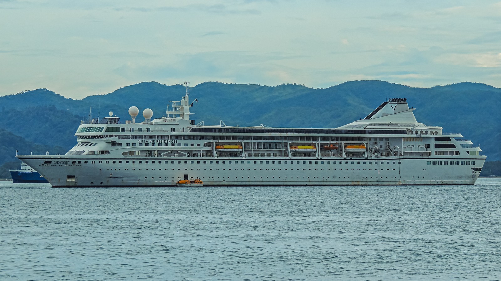 MS Villa Vie Odyssey residential cruise ship underway under clear sky