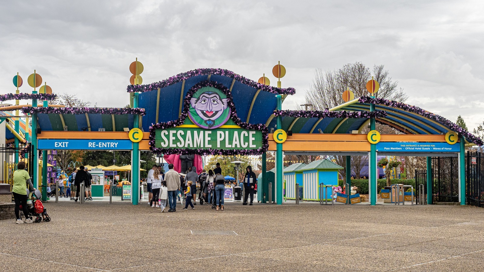 Sesame Place Philadelphia entrance gates with Count von Count logo and guests