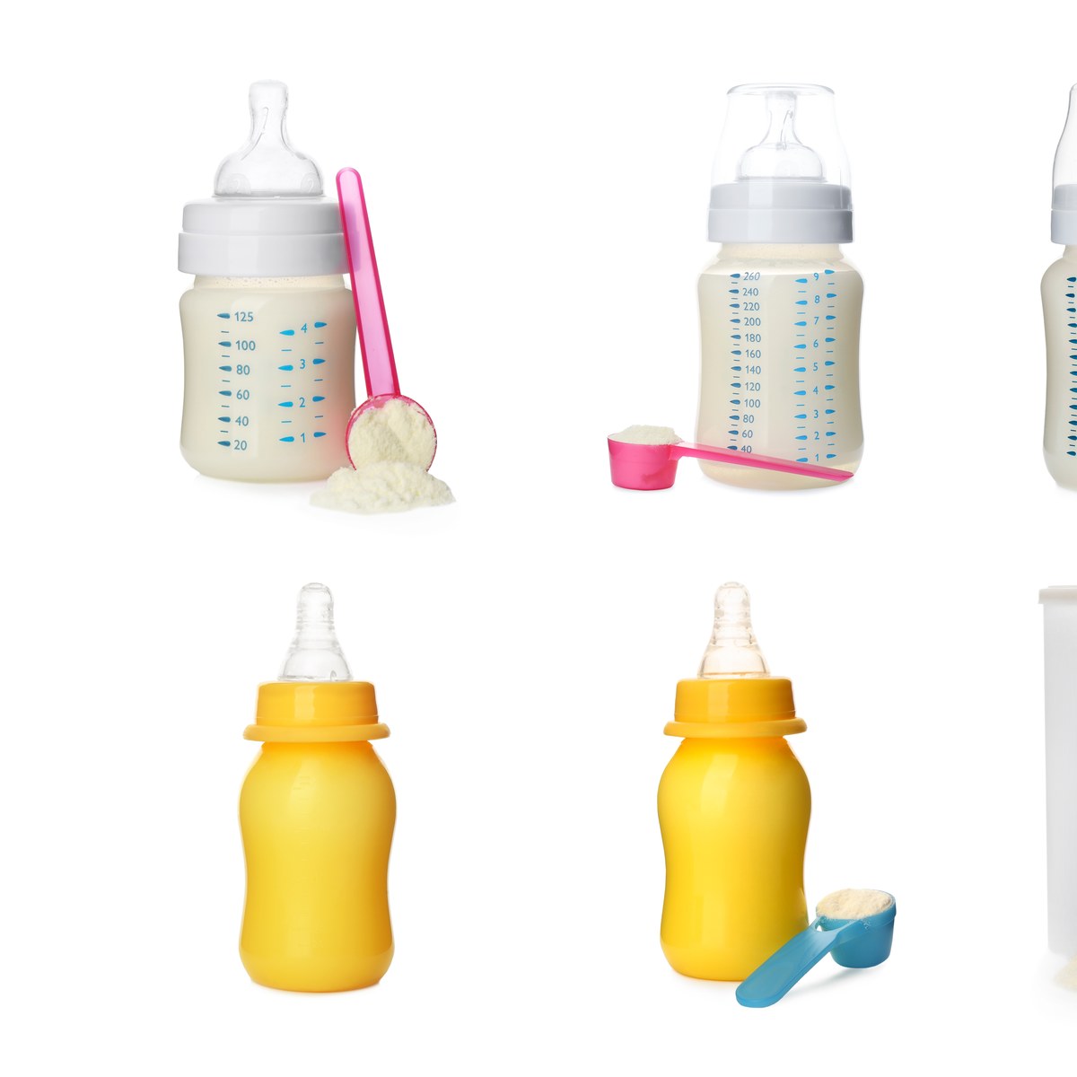 Baby formula bottles and powder scoops on a white background