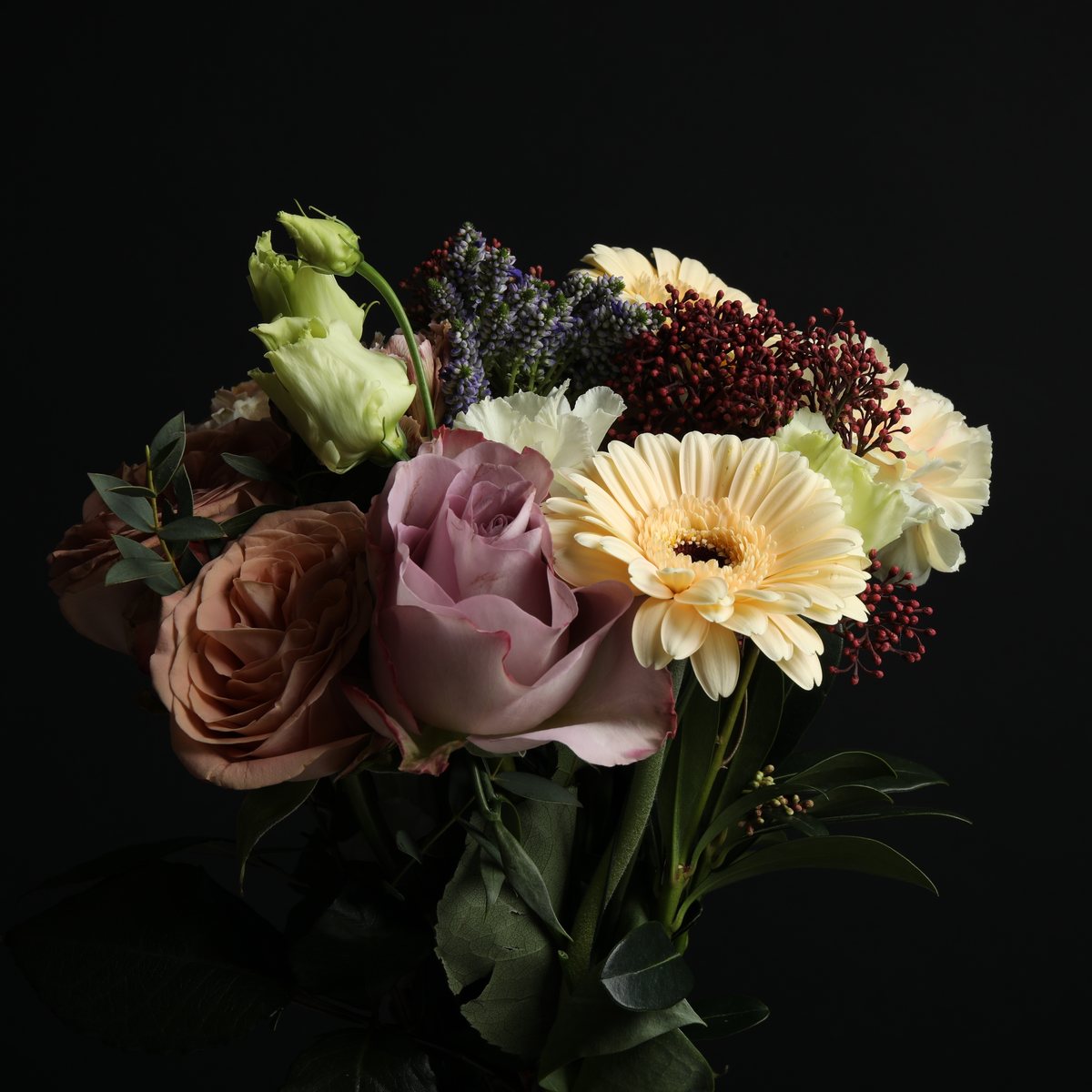 Bouquet of fresh flowers on a dark background