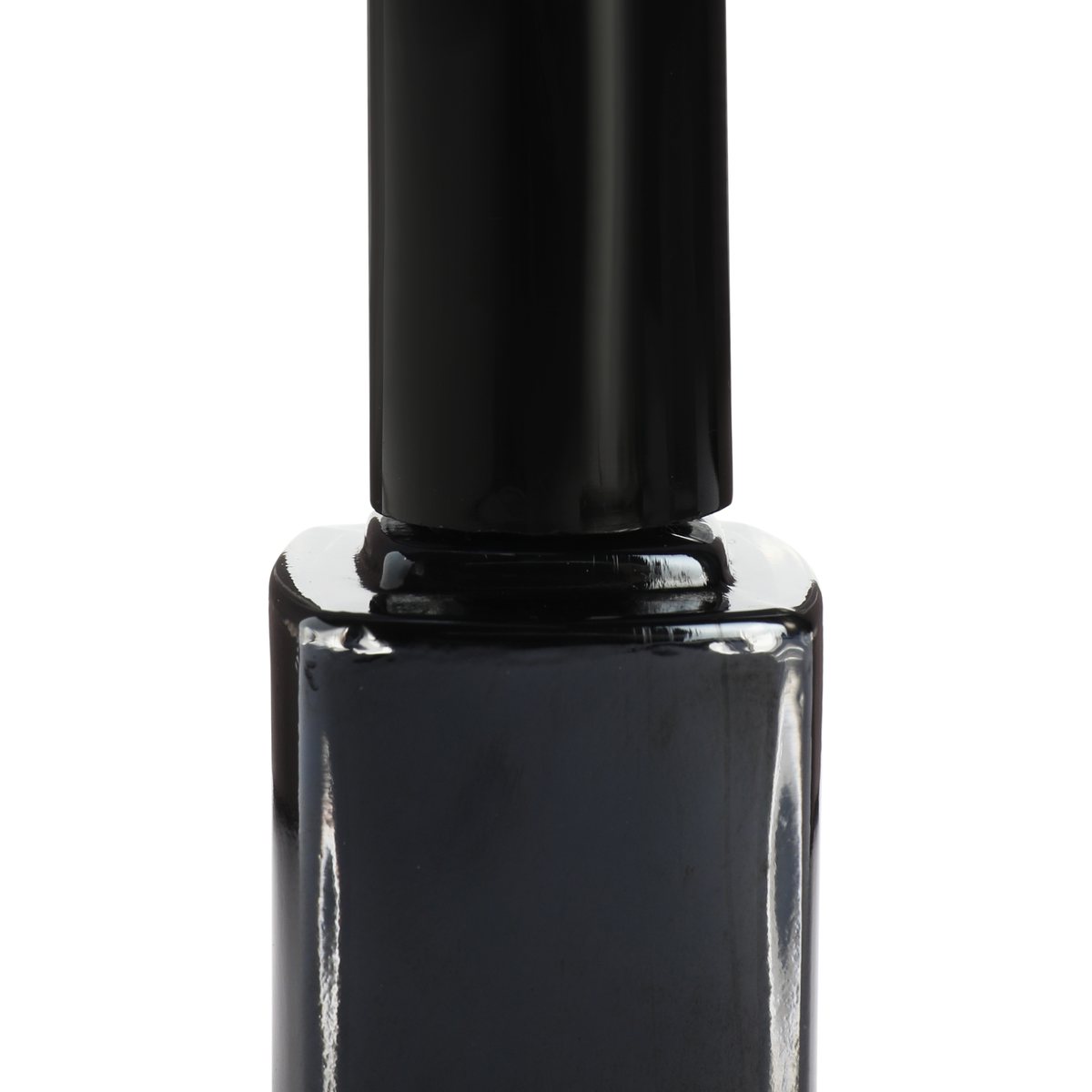 Black nail polish bottle close-up