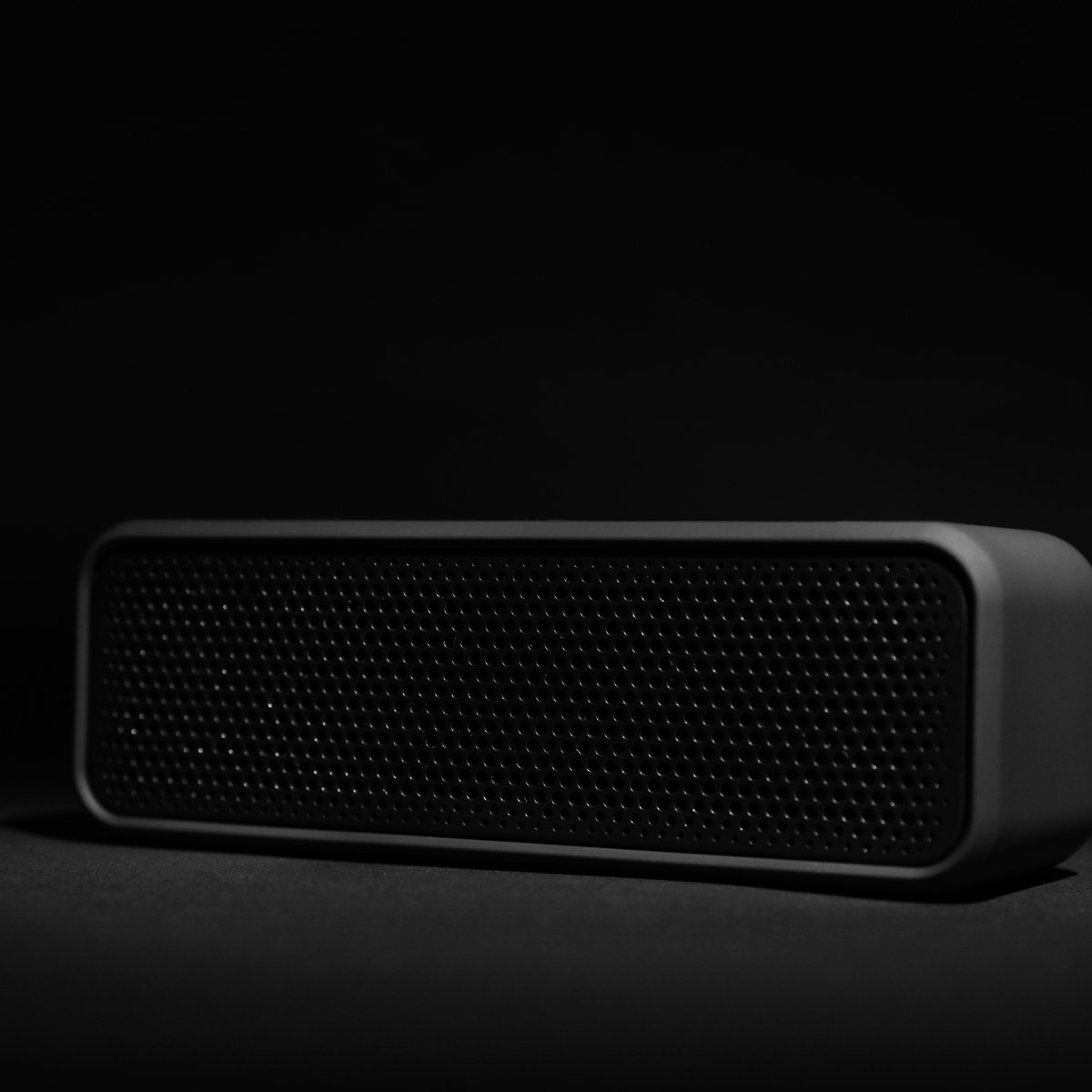 Portable Bluetooth speaker on a dark background