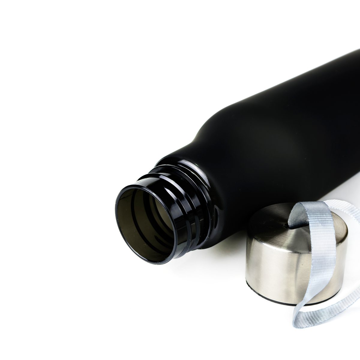 Black reusable water bottle with the cap off on a white background