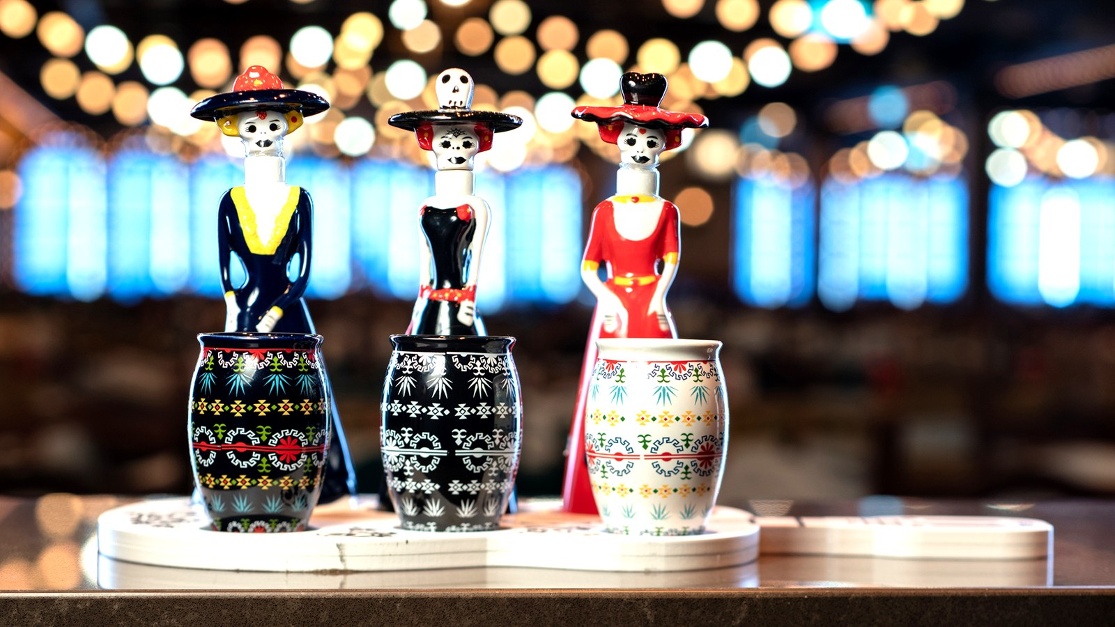 Day of the Dead figurines decorating a table at Plaza de Coco on the Disney Treasure