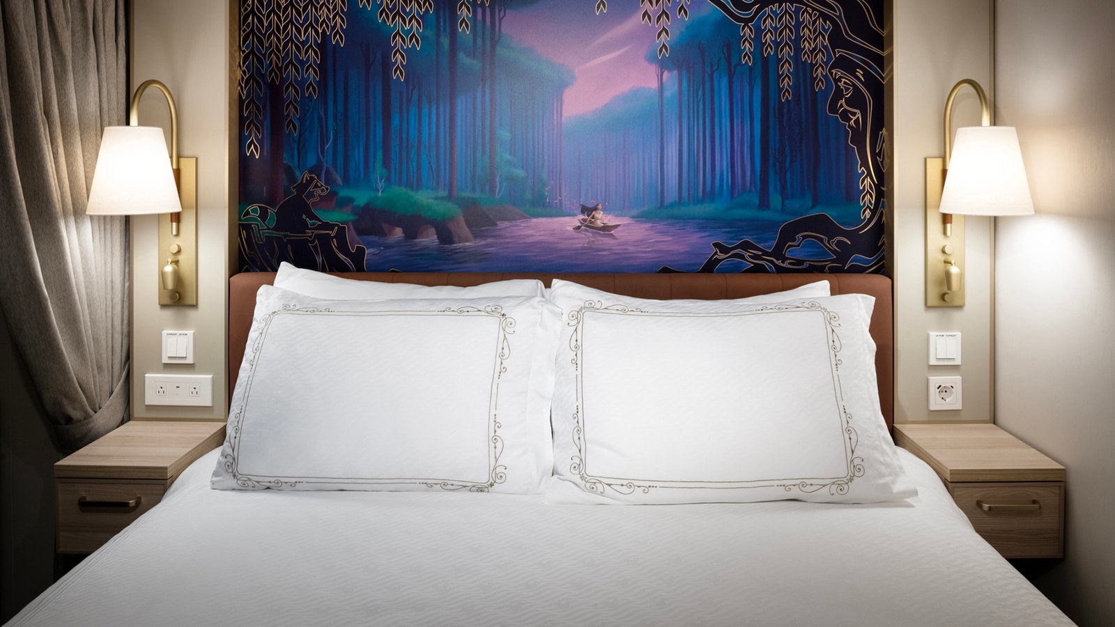 Deluxe Family Verandah stateroom with a themed headboard on the Disney Treasure