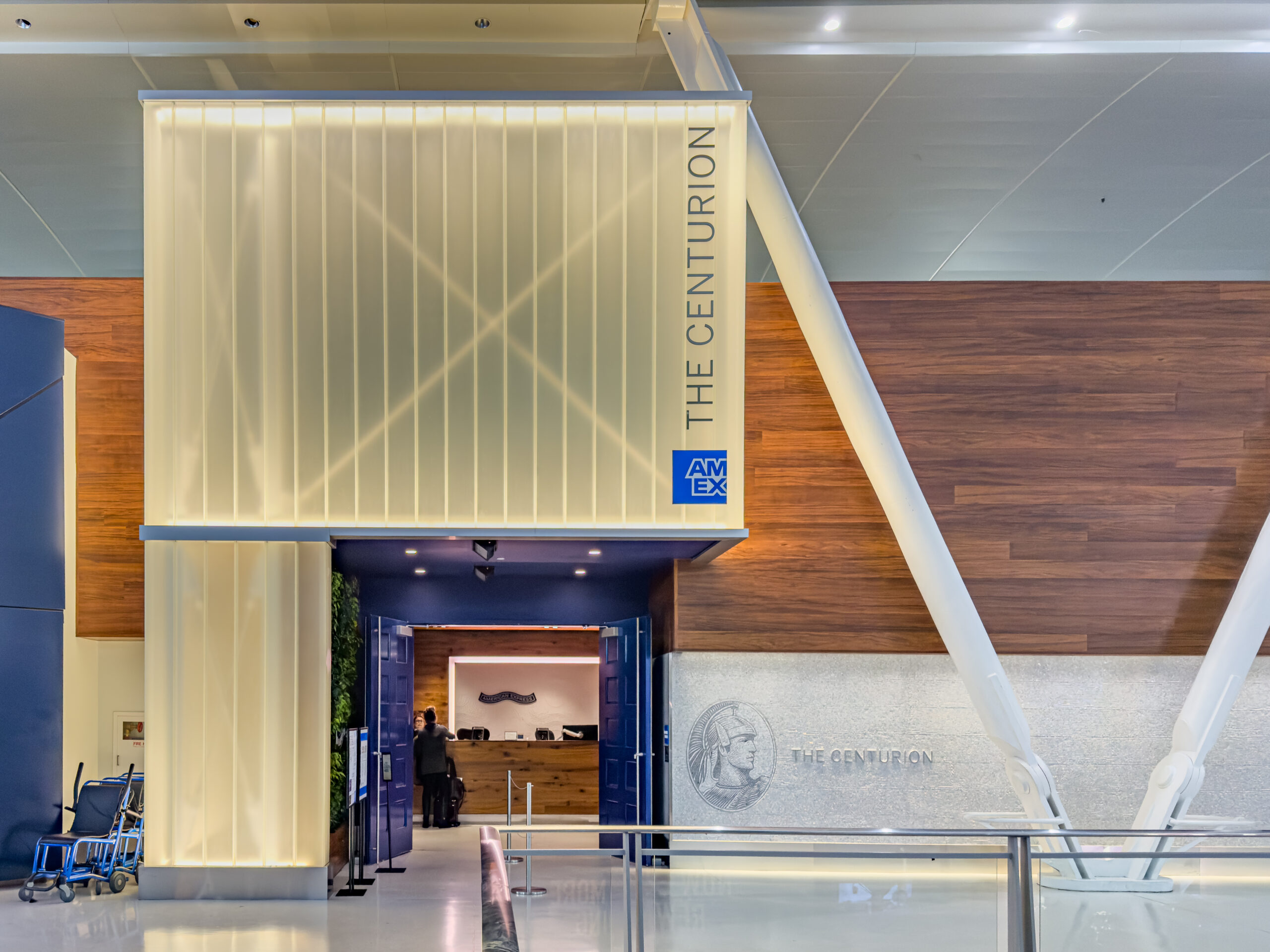 A comfortable, spacious, and upscale seating lounge area inside American Express Centurion Lounge past security at JFK Terminal 4