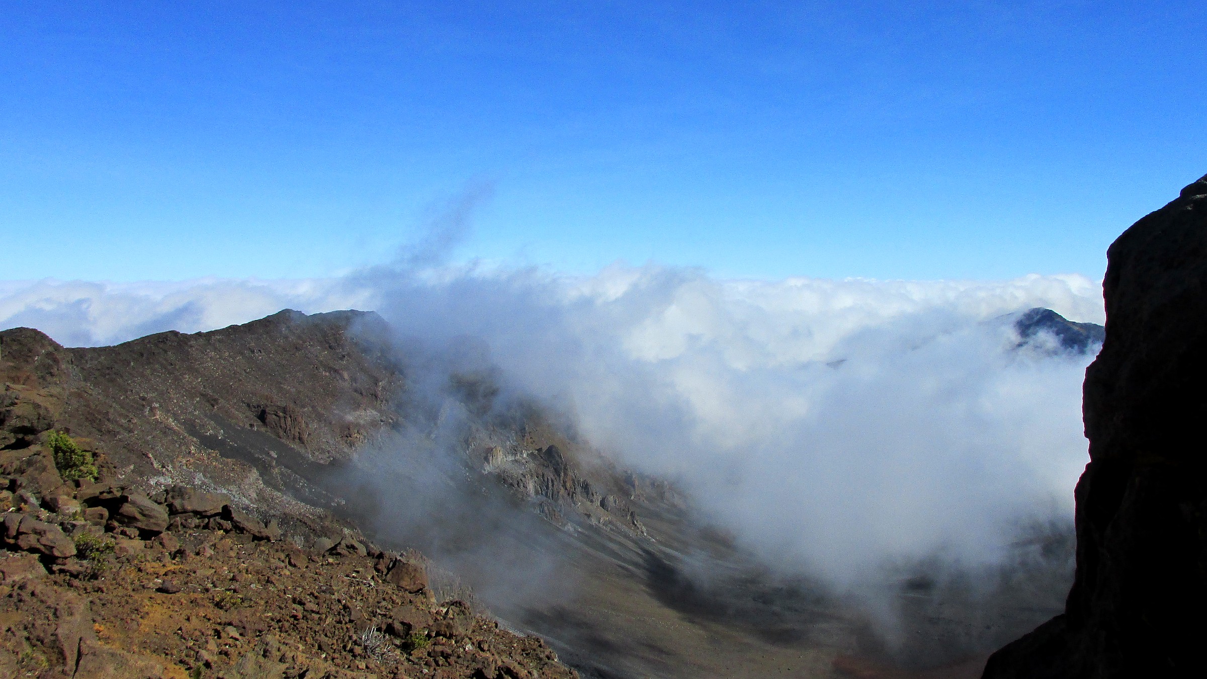 Volcanic summit crater above the clouds at Haleakala National Park
