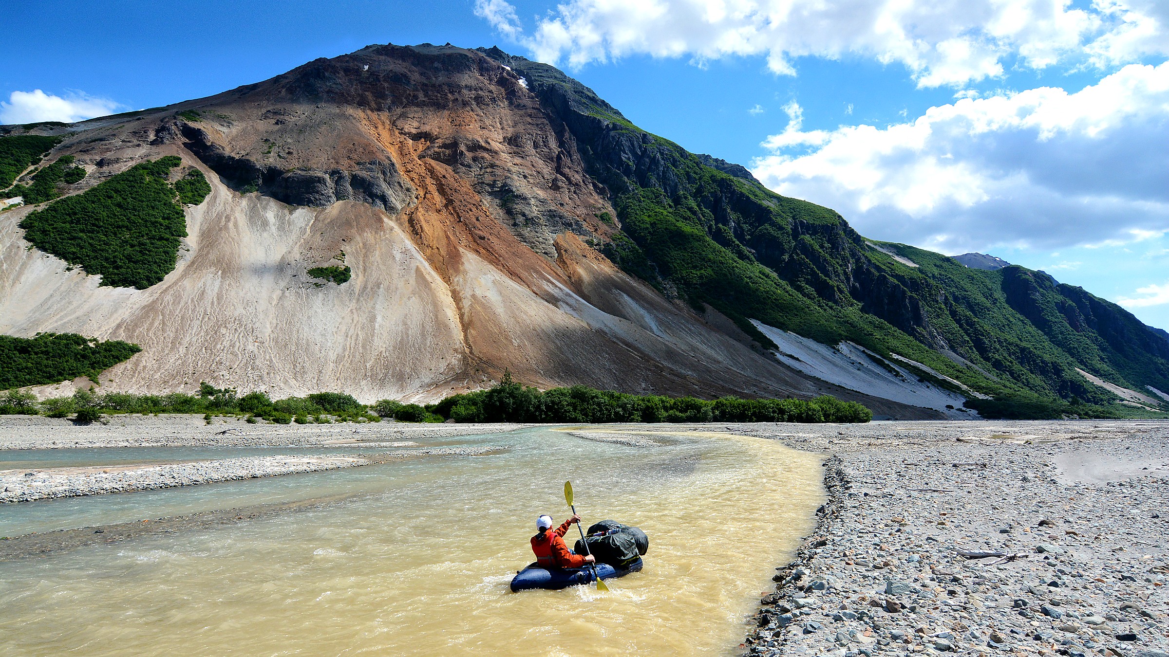 Brown bears fishing Brooks Falls under volcanic country at Katmai National Park