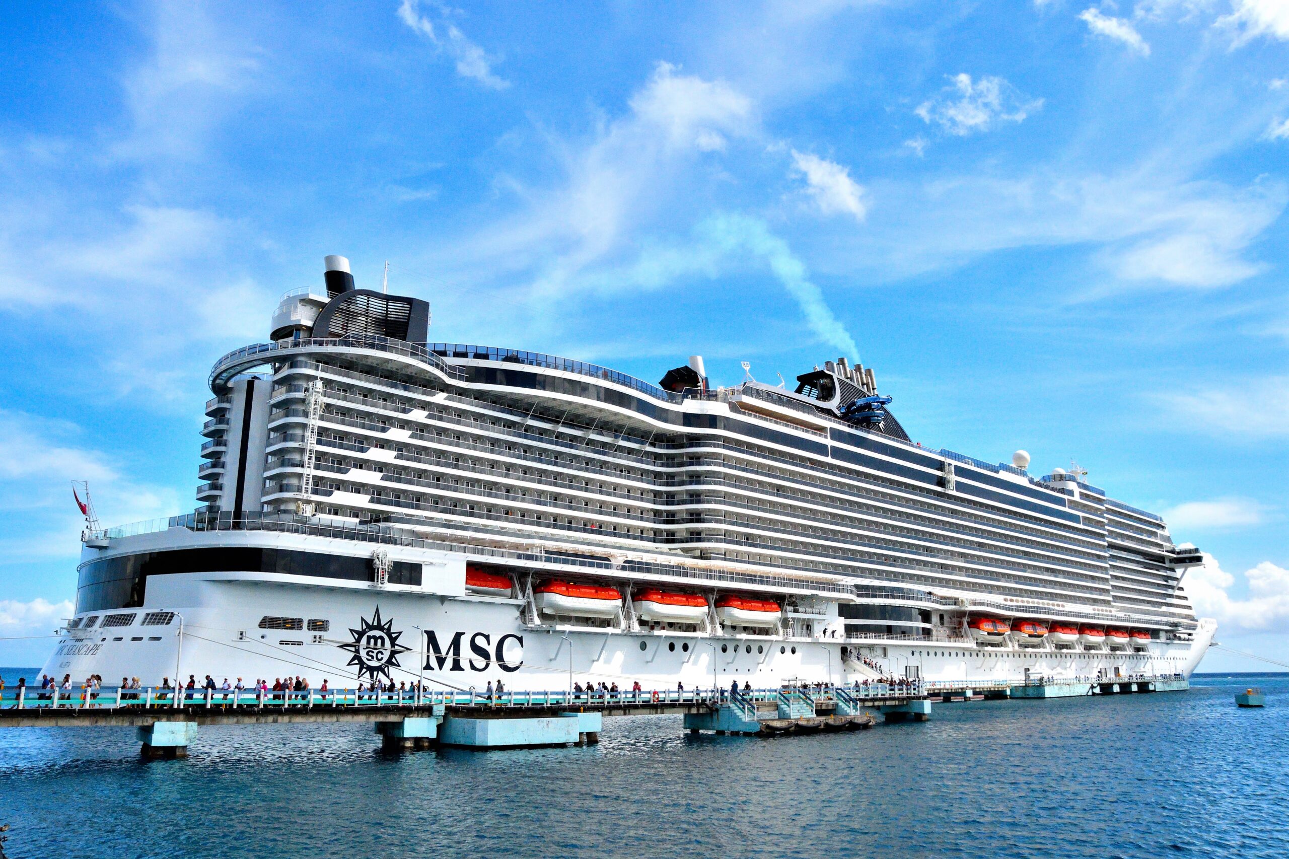 The magnificent MSC Seascape cruise ship sailing through calm waters, showing its modern Seaside EVO class layout and multi deck structure.