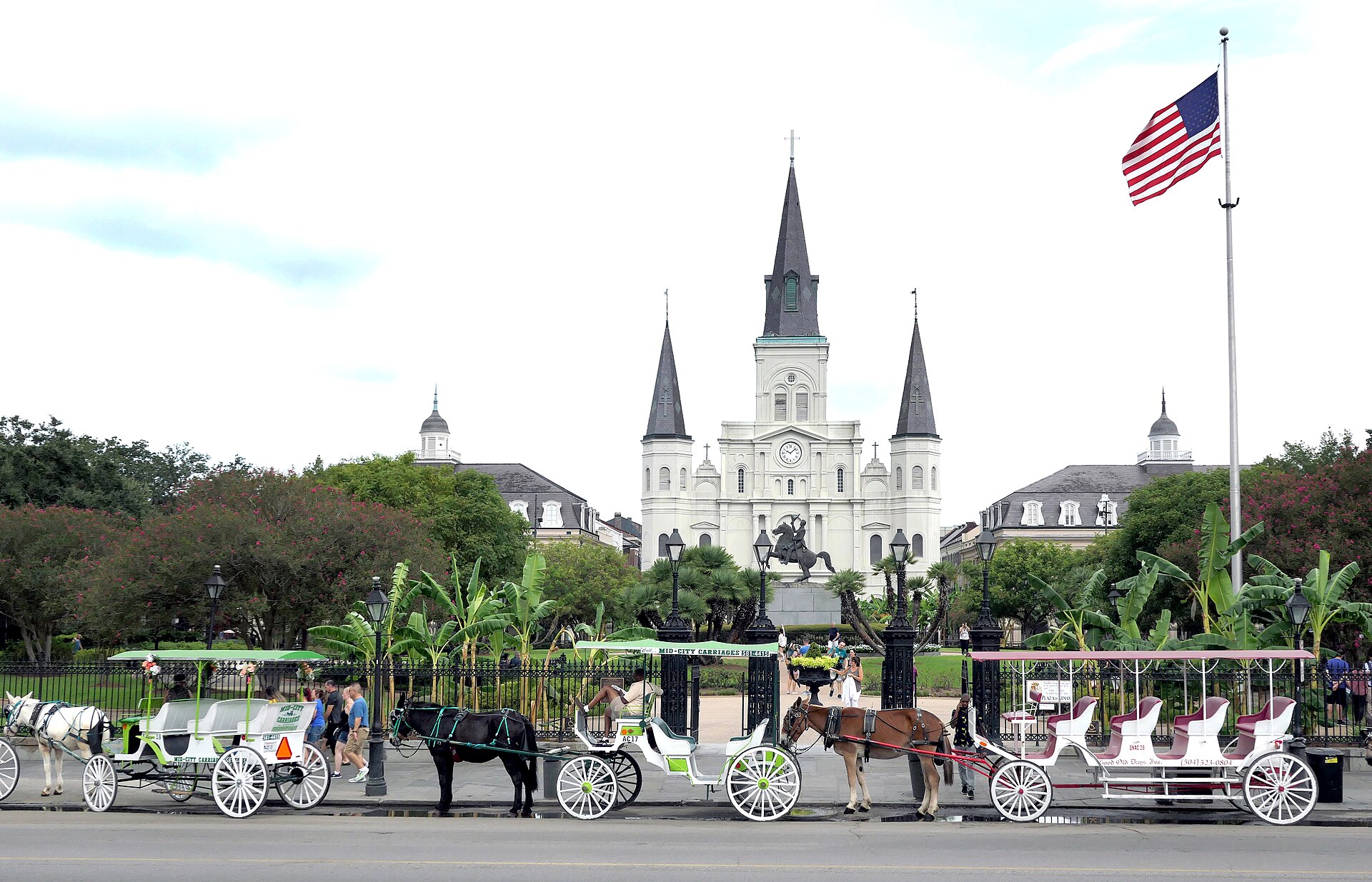 Horse drawn carriages in front of St. Louis Cathedral at Jackson Square in New Orleans